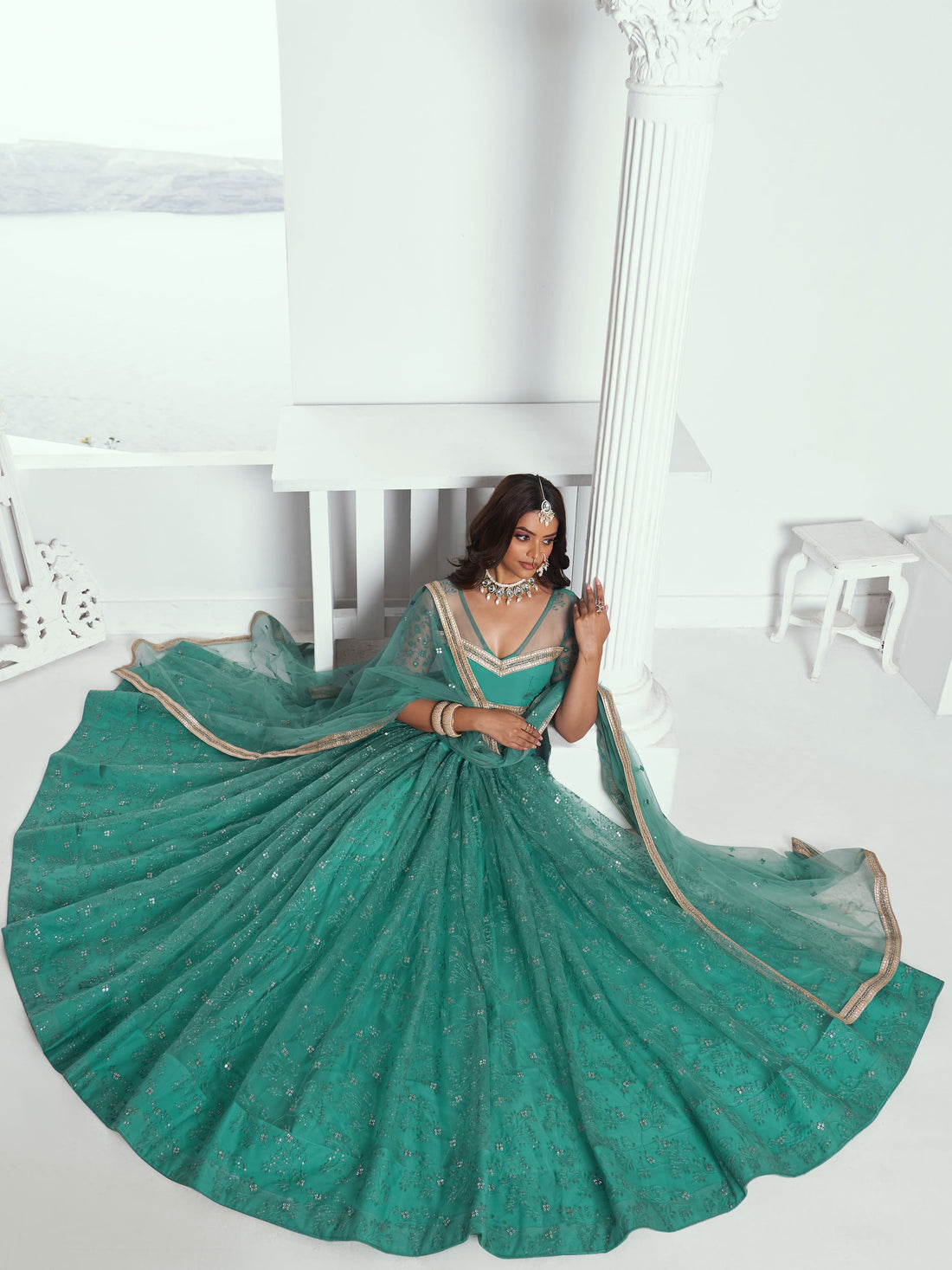 Beautiful Teal Green Embroidered Net Wedding Wear Lehenga Choli