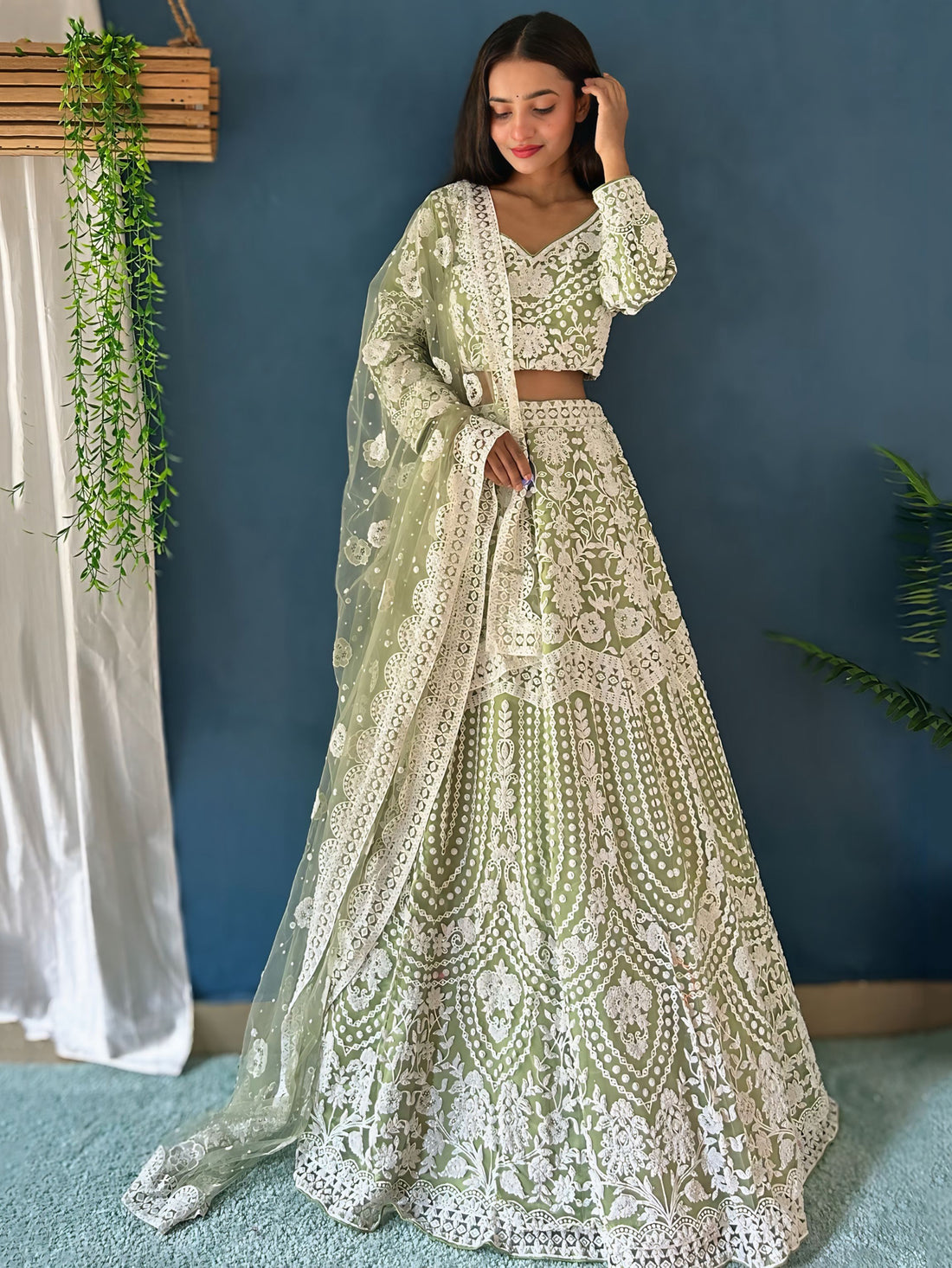 Dazzling Pista Green Pearl Work Net Reception Wear Lehenga Choli