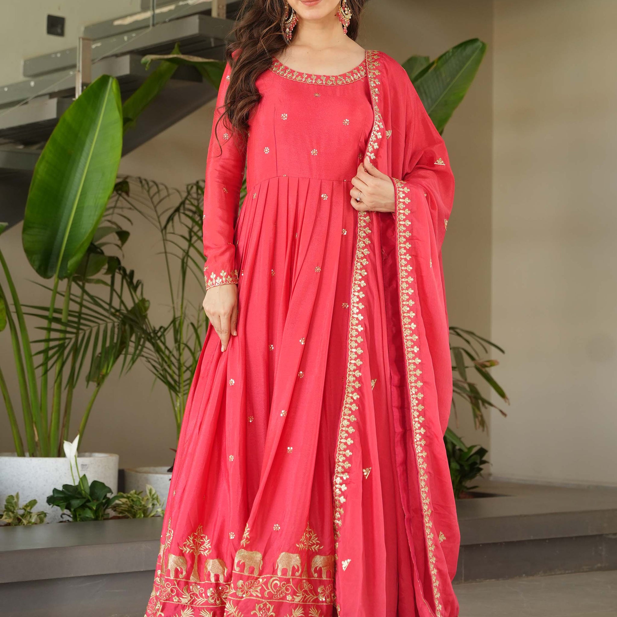 Fascinating Peach Zari Embroidered Chinon Festival Wear Gown