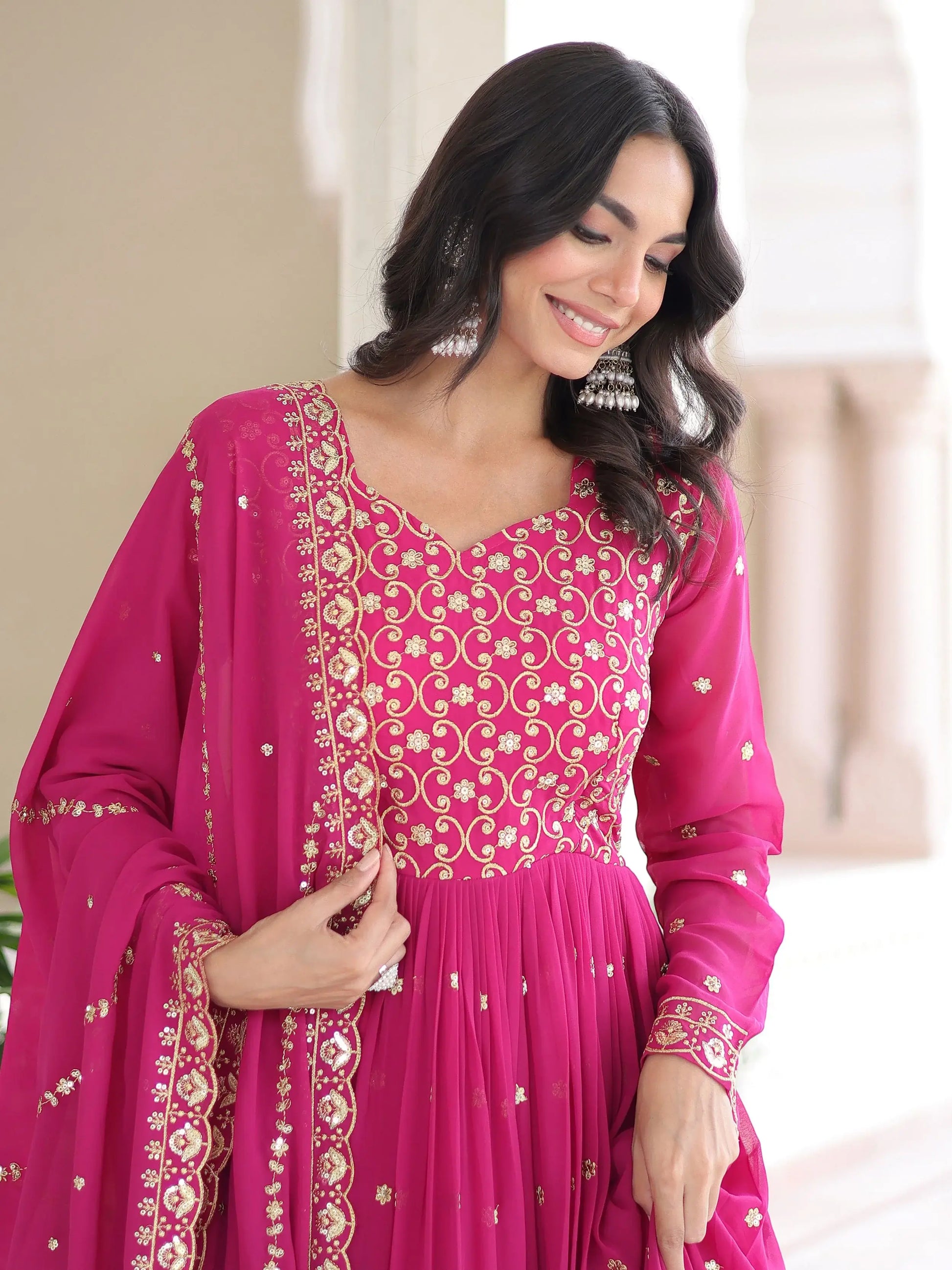 Alluring Rani Pink Zari Work Georgette Designer Gown With Dupatta