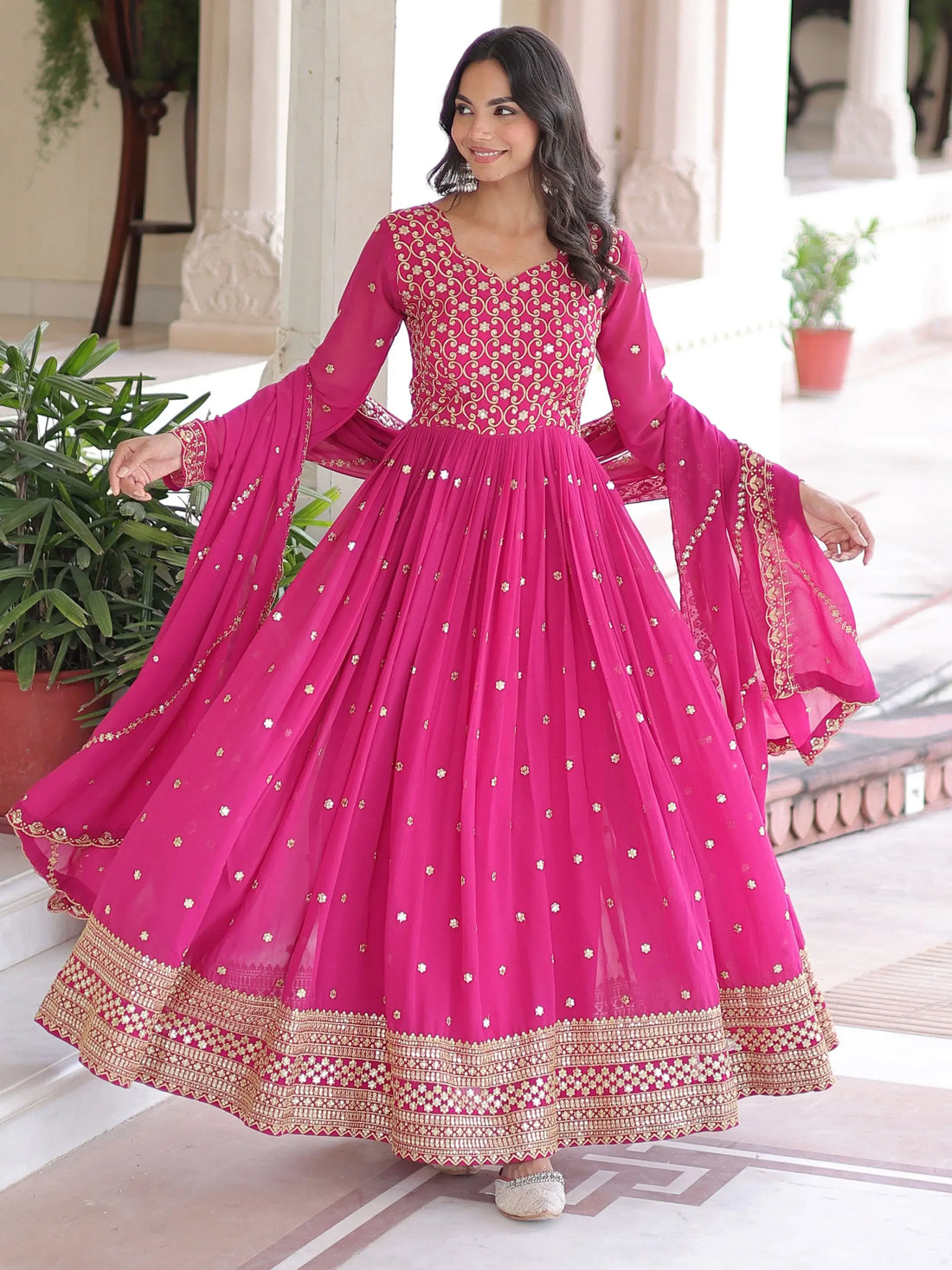 Alluring Rani Pink Zari Work Georgette Designer Gown With Dupatta