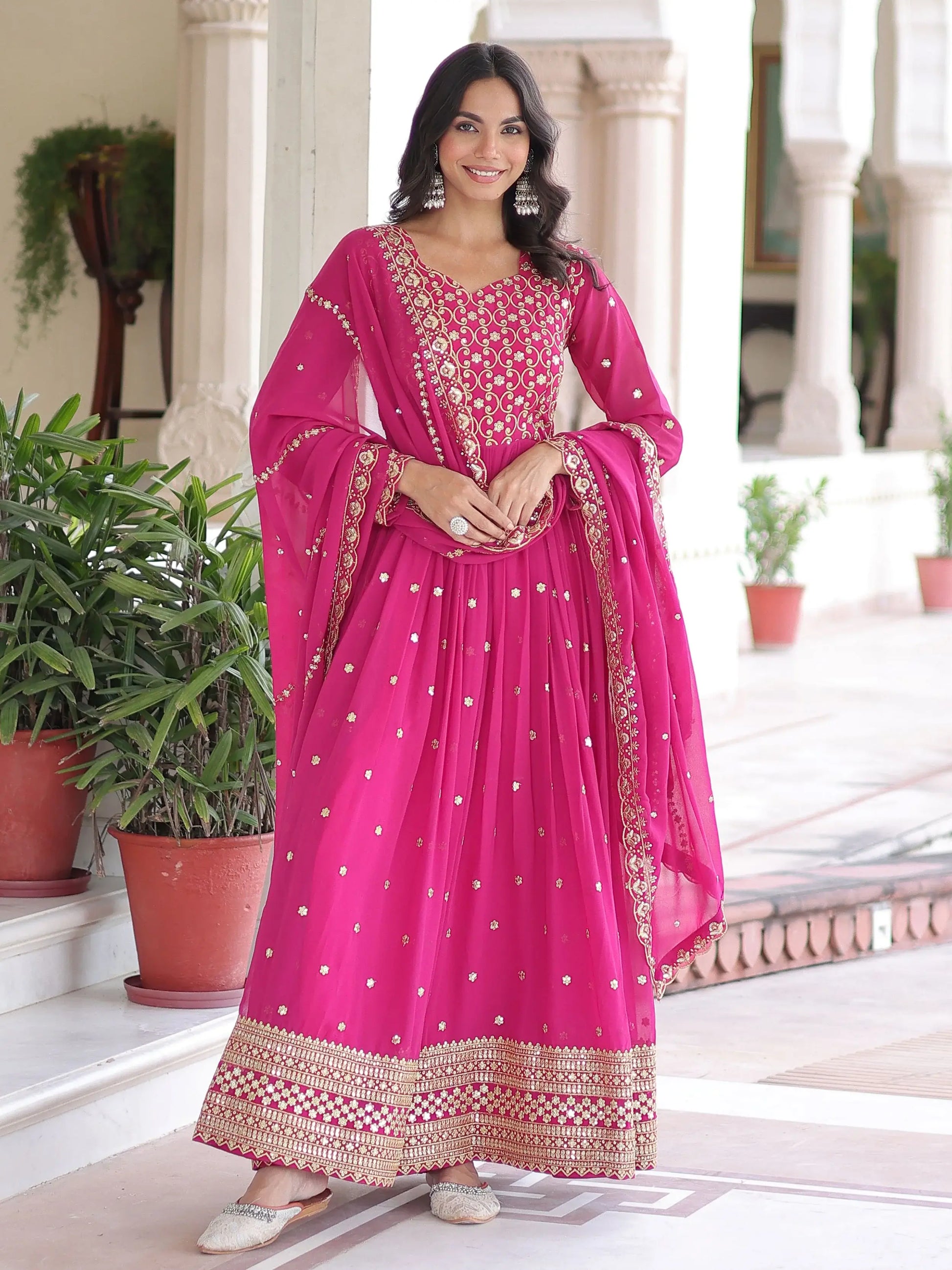 Alluring Rani Pink Zari Work Georgette Designer Gown With Dupatta