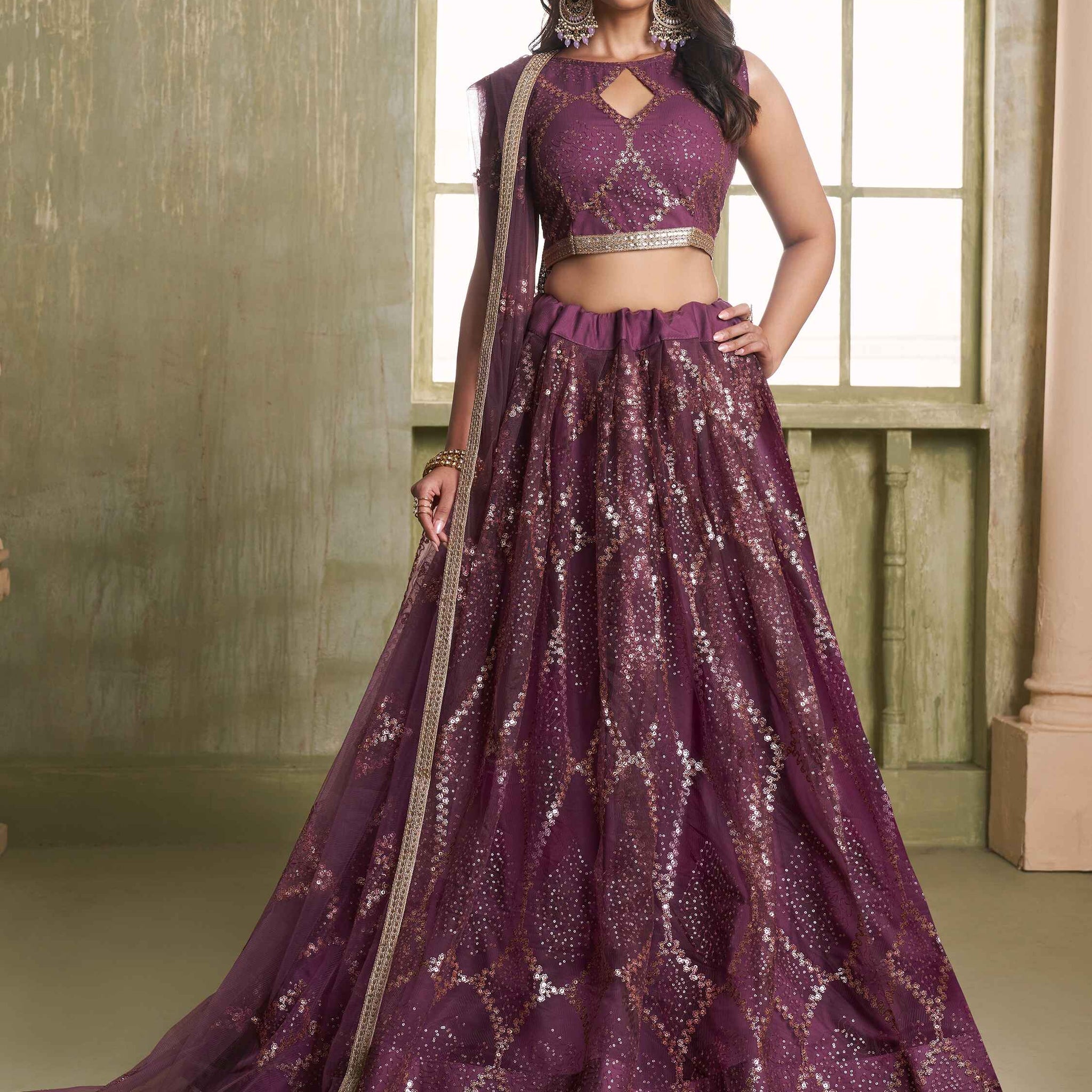 Attractive Wine Sequins Net Party Wear Lehenga Choli With Dupatta