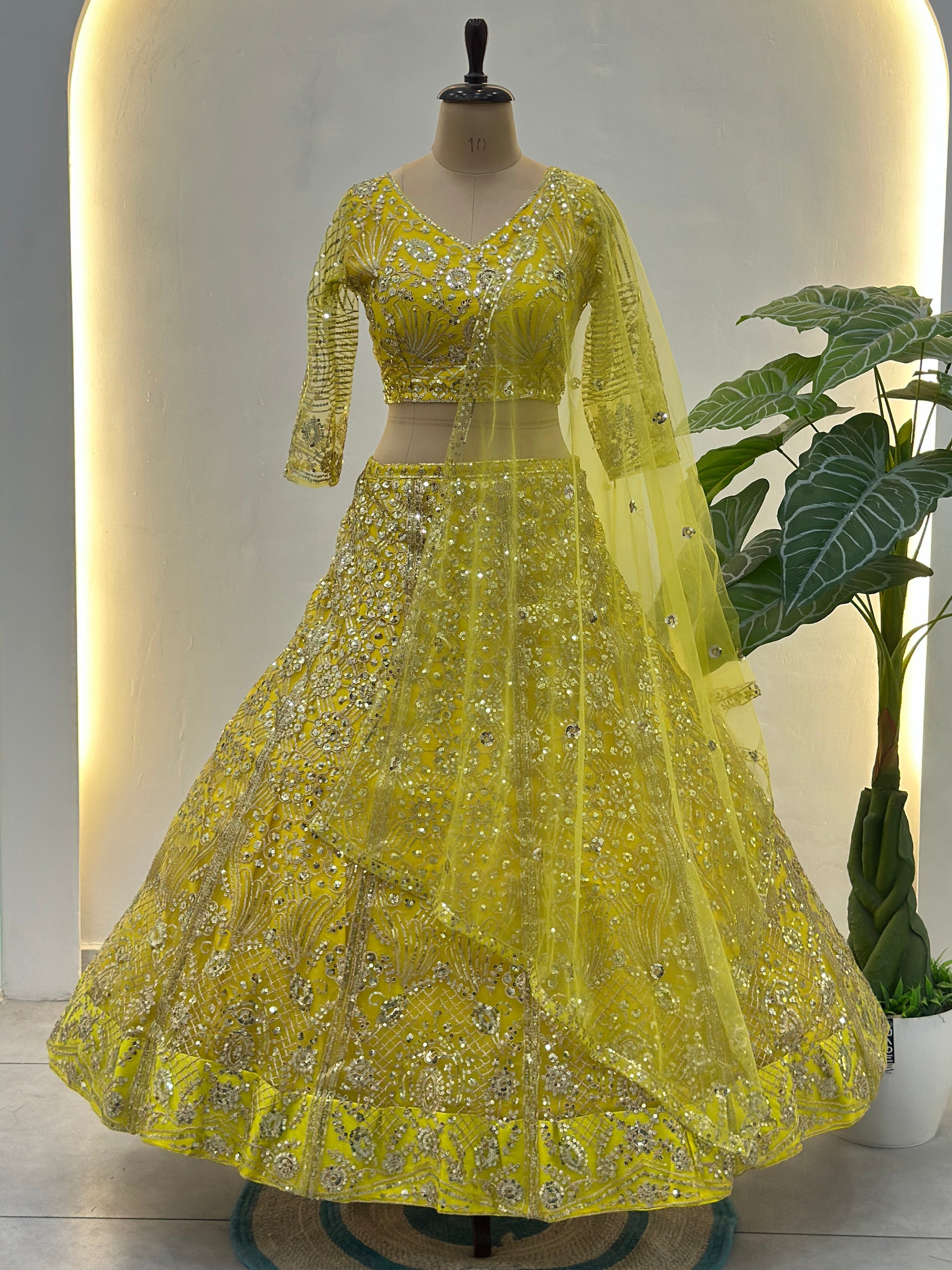 Beautiful Yellow Sequins Net Reception Wear Lehenga Choli With Dupatta