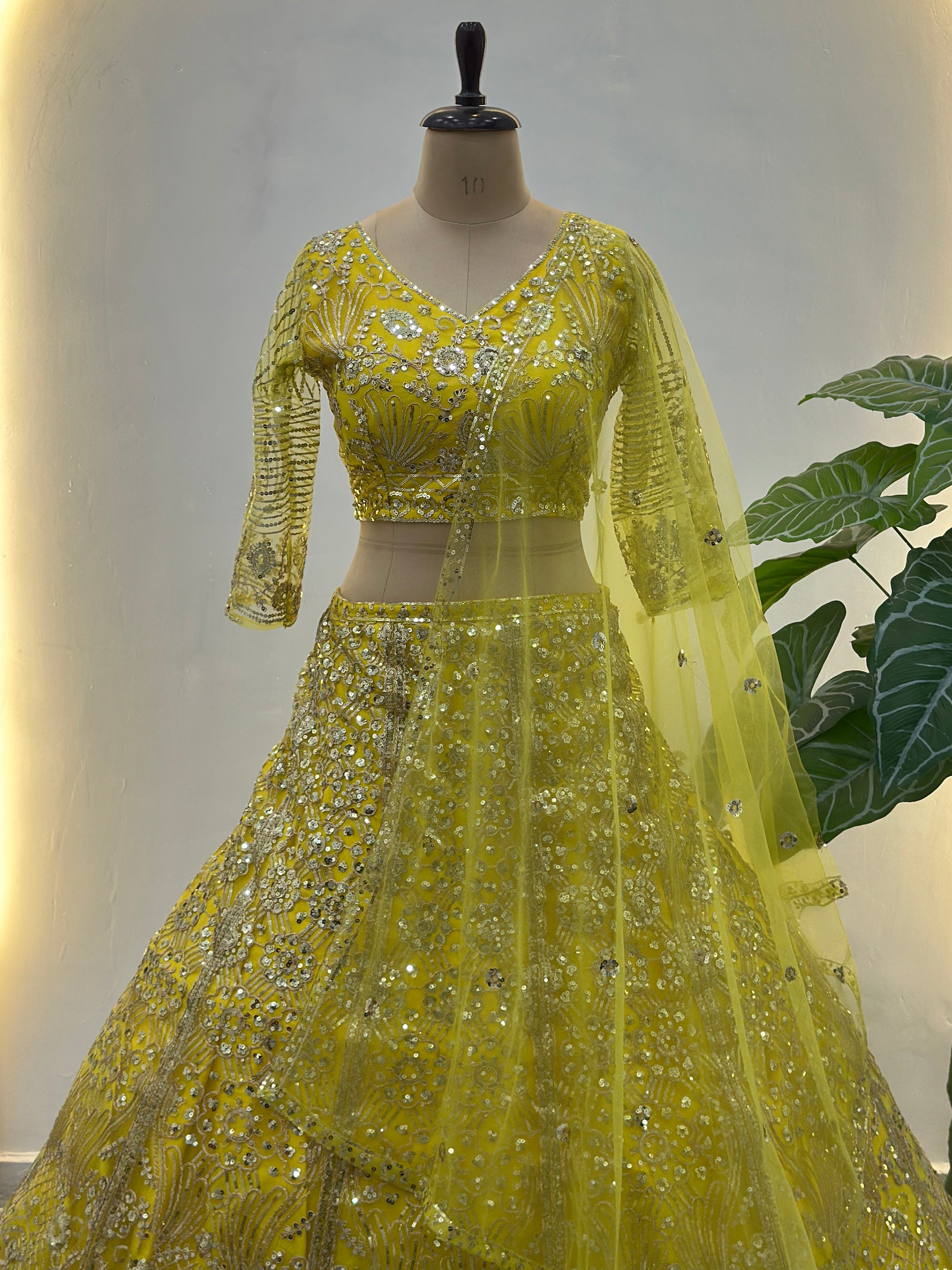 Beautiful Yellow Sequins Net Reception Wear Lehenga Choli With Dupatta