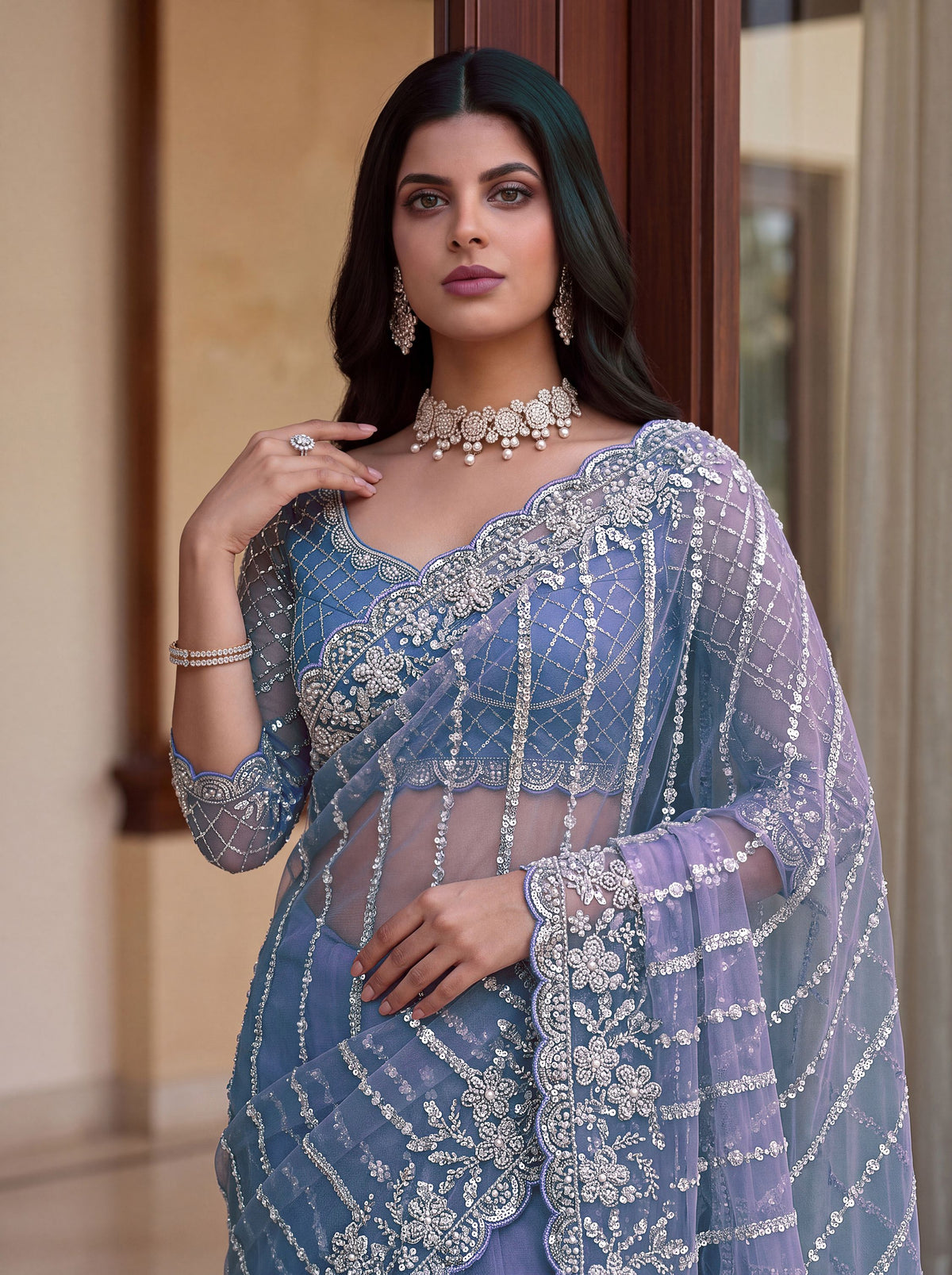 Mesmerizing Blue Pearl Work Net Reception Wear Saree