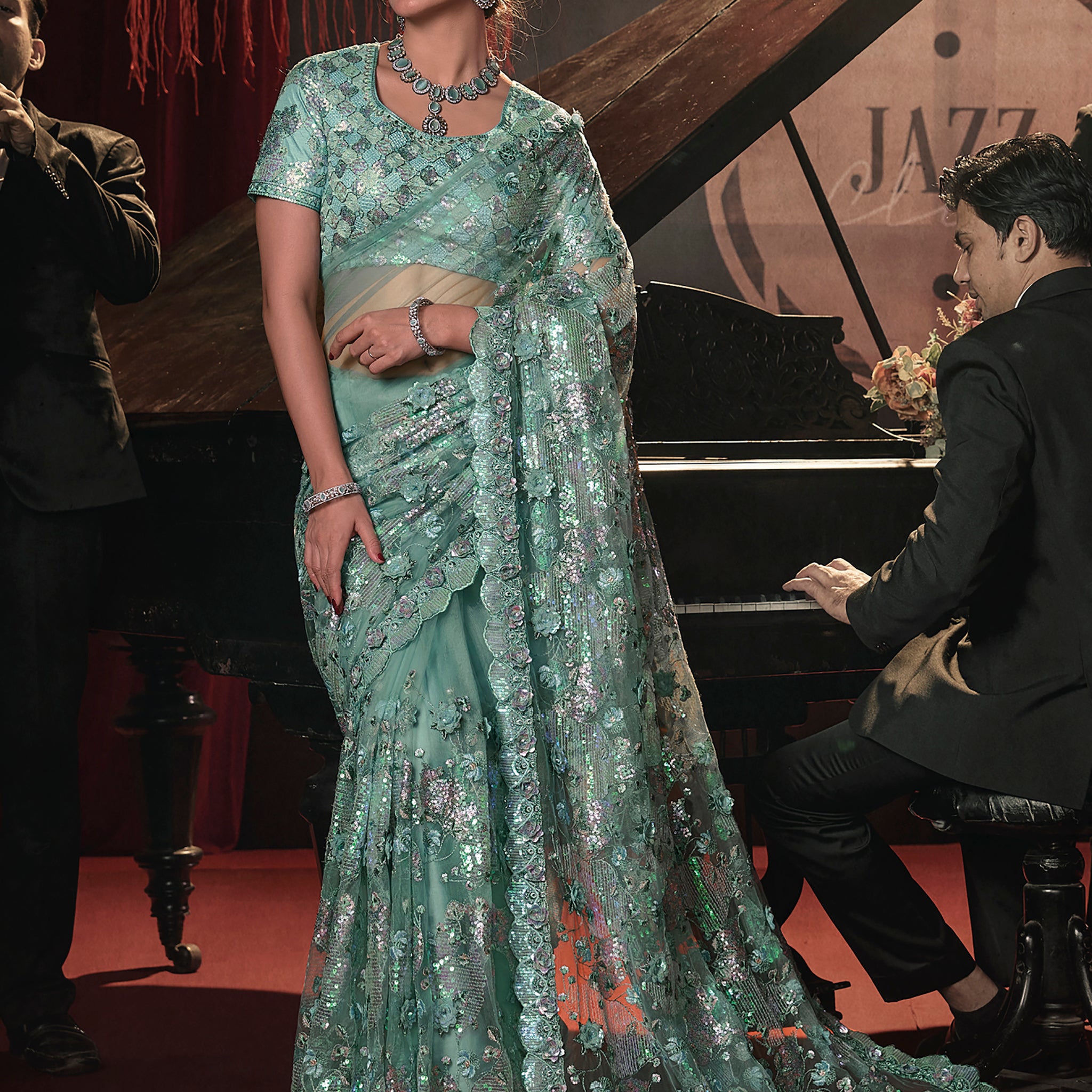 Marvelous Sea Green Sequins Net Designer Saree With Blouse