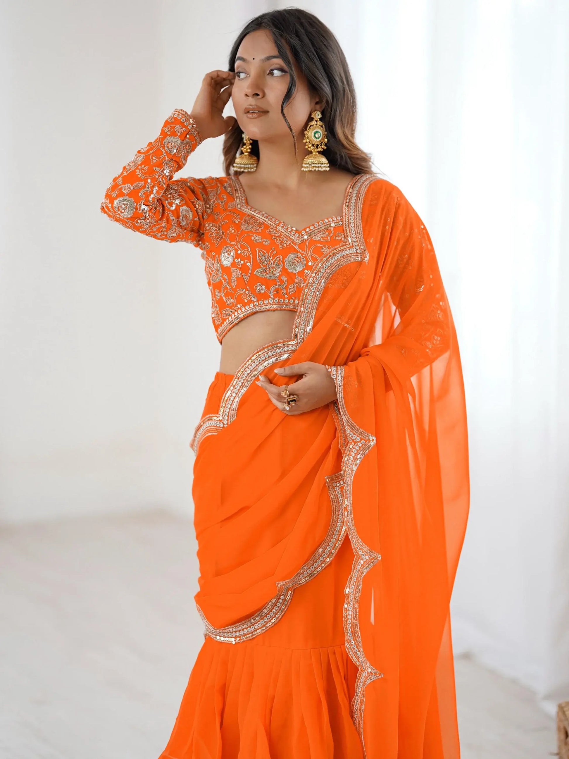 Lovely Orange Georgette Party Wear Ruffle Lehenga Saree With Embroidered Blouse