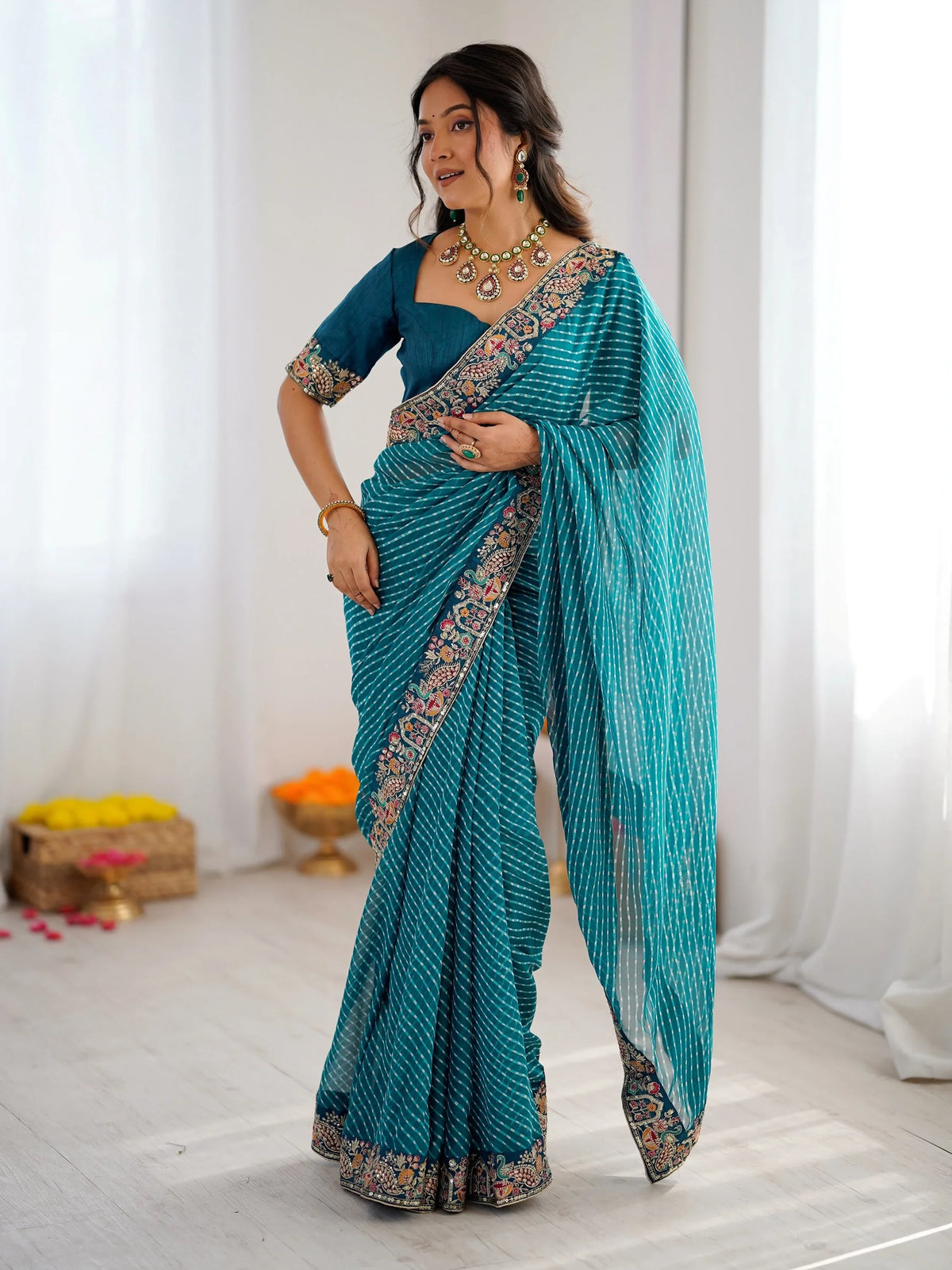 Enchanting Teal Blue Sequins Work Georgette Function Wear Saree