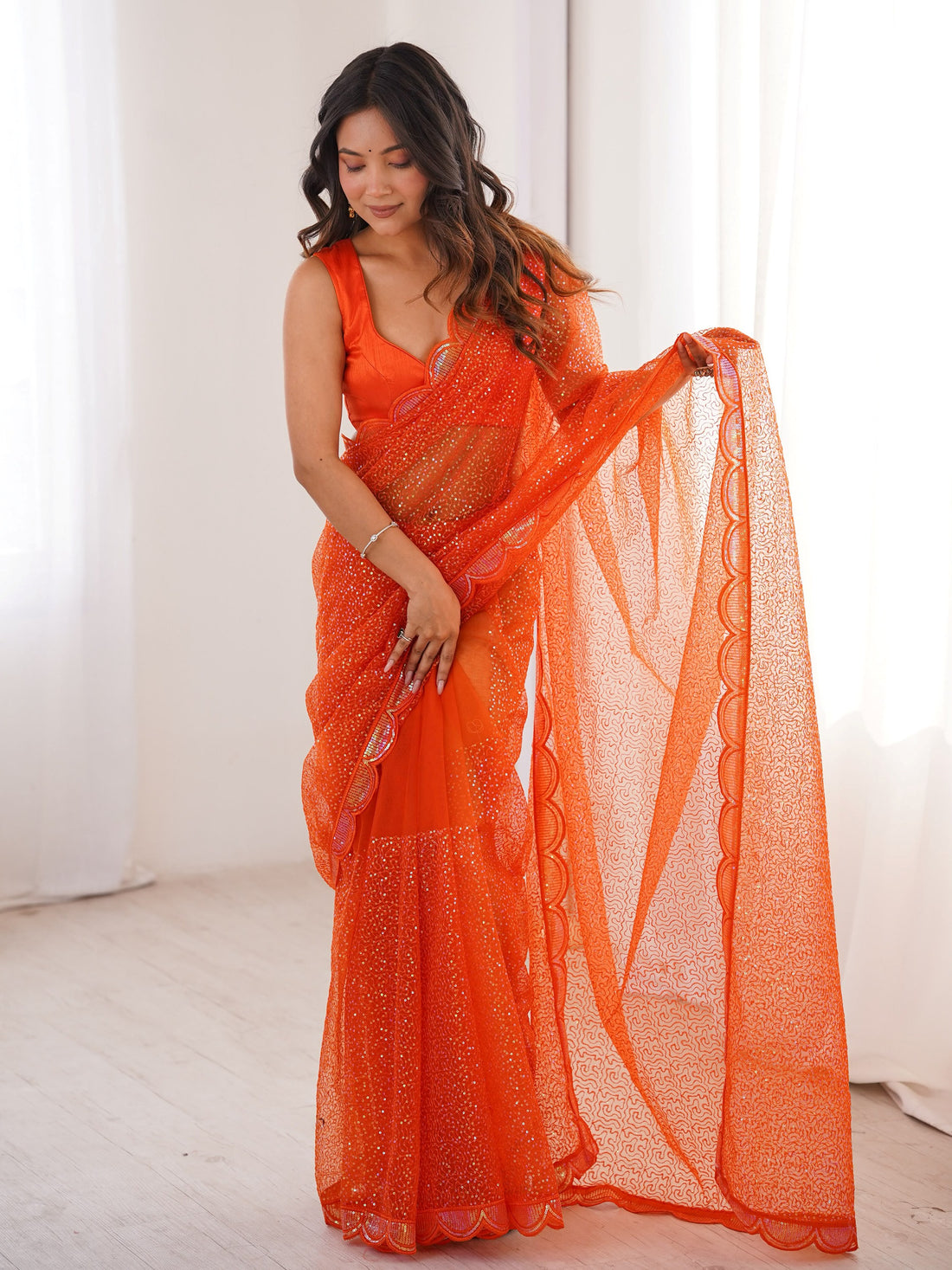 Fabulous Orange Sequins Work Net Party Wear Saree