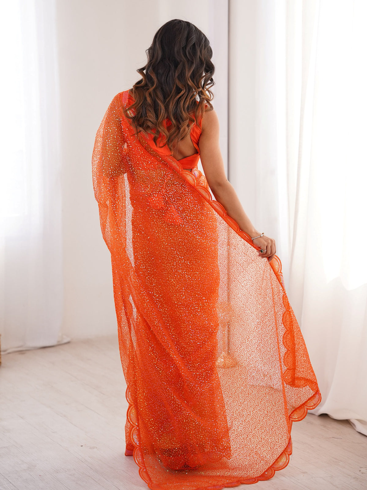 Fabulous Orange Sequins Work Net Party Wear Saree