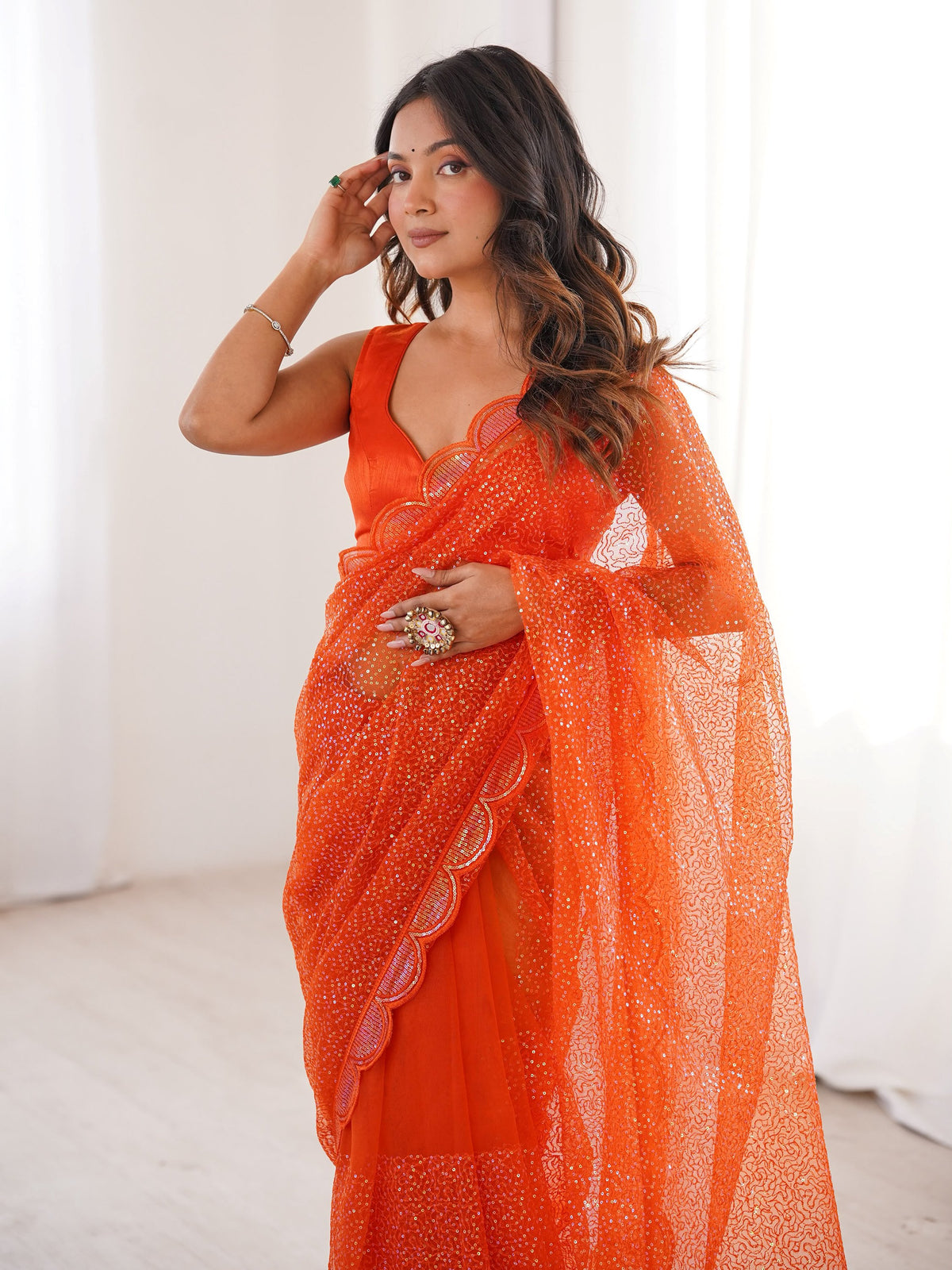 Fabulous Orange Sequins Work Net Party Wear Saree