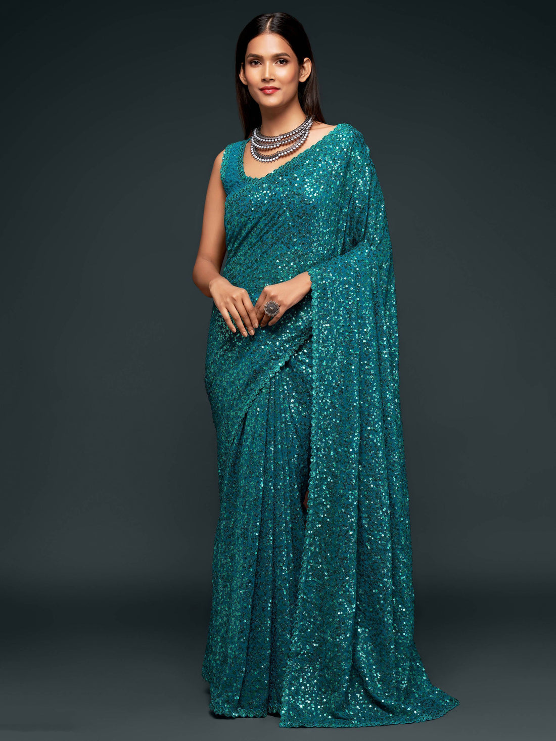 Stunning Teal Blue Sequins Georgette Reception Wear Saree