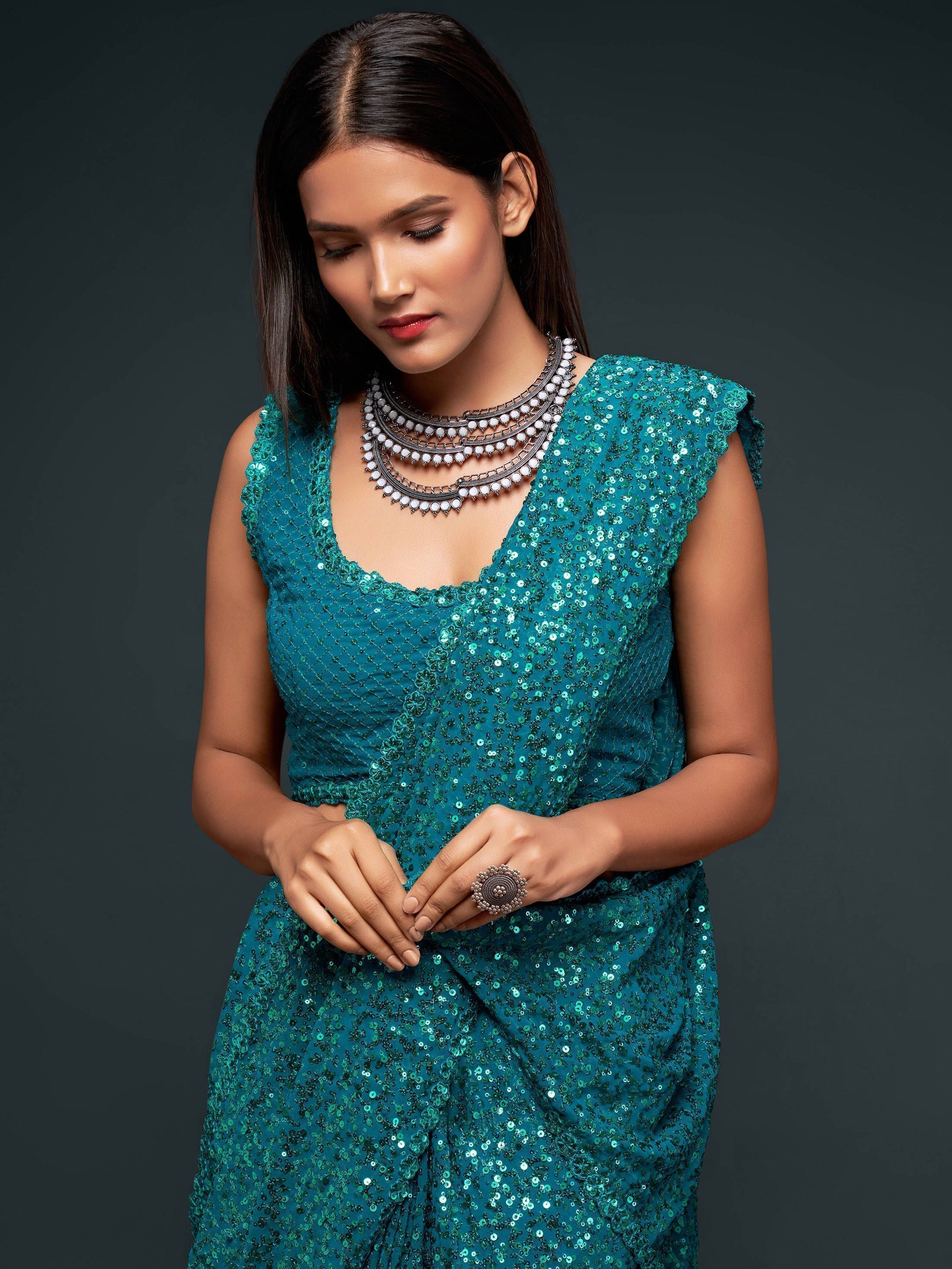 Stunning Teal Blue Sequins Georgette Reception Wear Saree