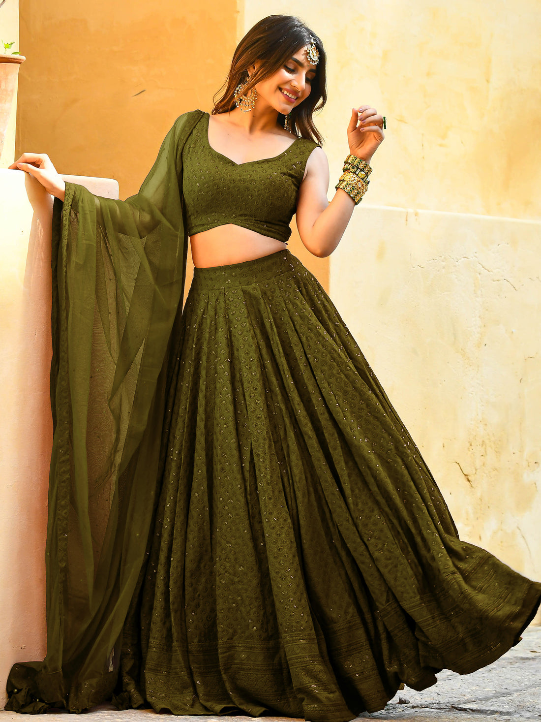 Bewitching Mehendi Green Sequins Georgette Lehenga Choli With Net Dupatta