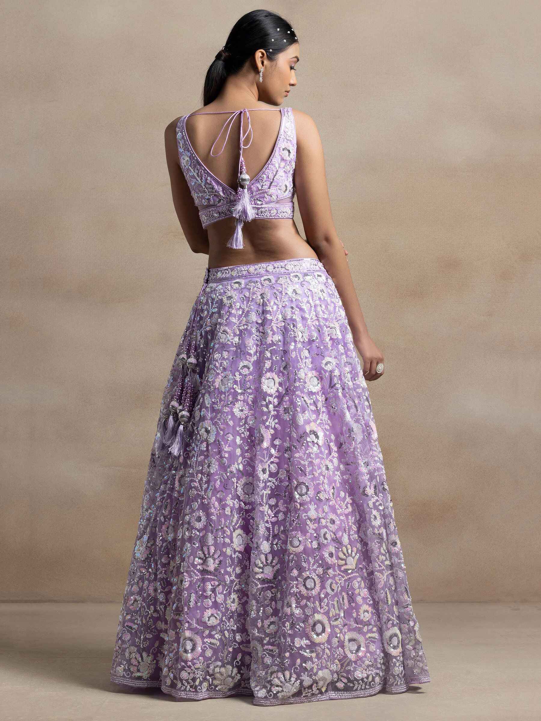 Surprising Lavender Sequins Net Reception Wear Lehenga Choli