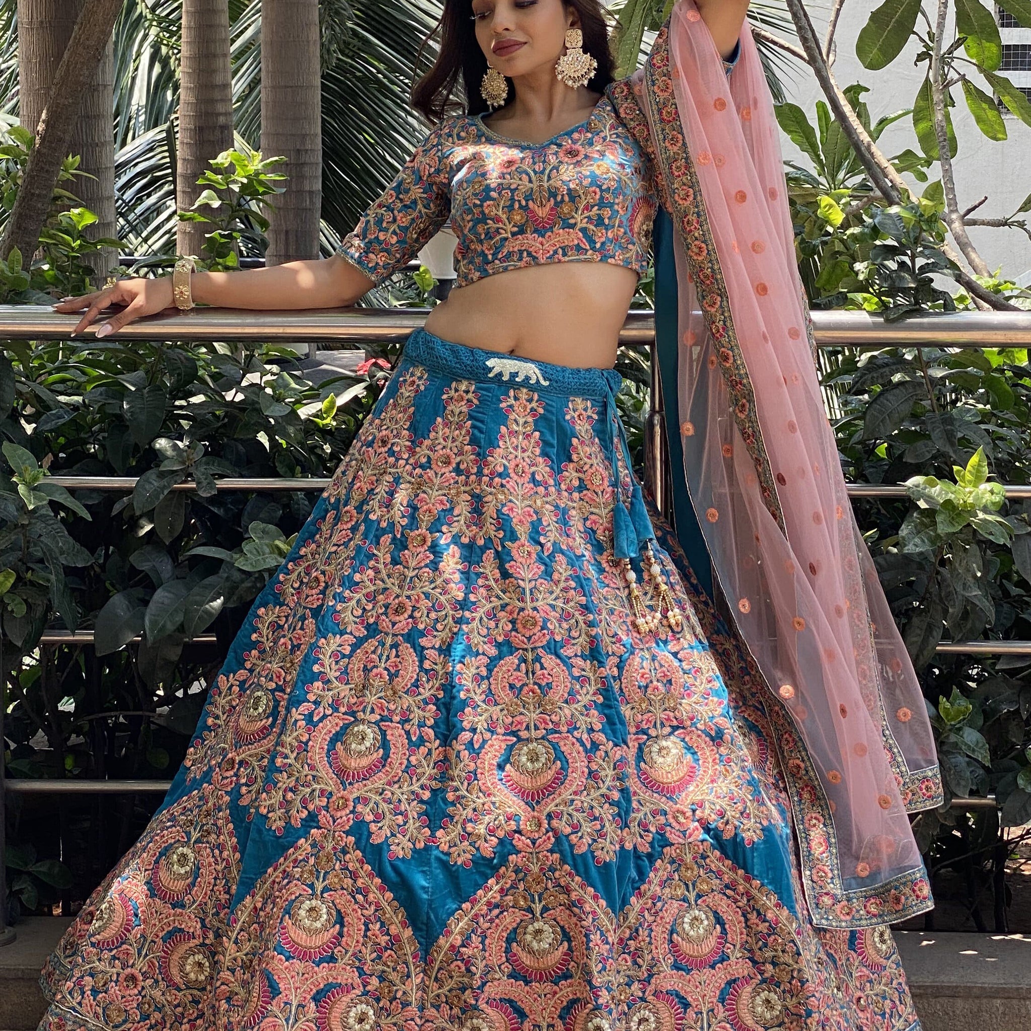 Attractive Blue Embroidered Velvet Wedding Wear Lehenga Choli