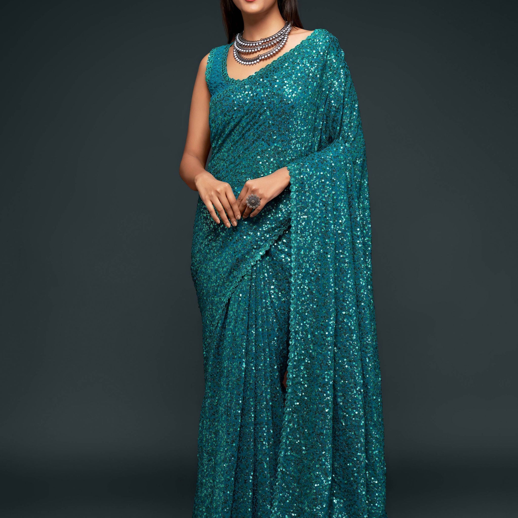 Attractive Teal  Blue Sequined Georgette Party Wear Saree
