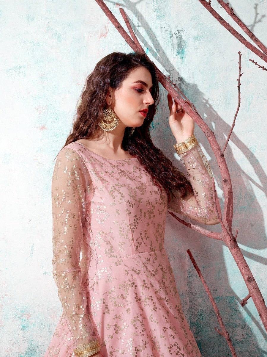 Pink floral embroidered dress with sheer sleeves, gold jewelry, and elegant styling for women's fashion