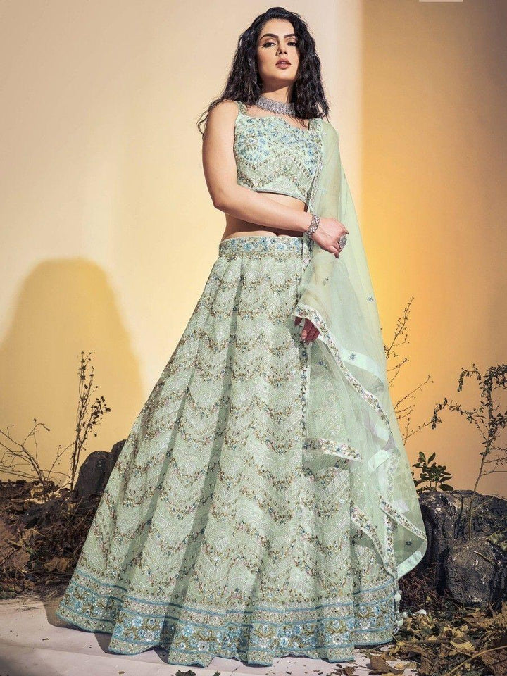 Cute Turquoise Embroidered Net Engagements Wear Lehenga Choli