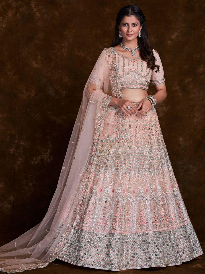 Charming Peach Thread Embroidered Net Reception Wear Lehenga Choli