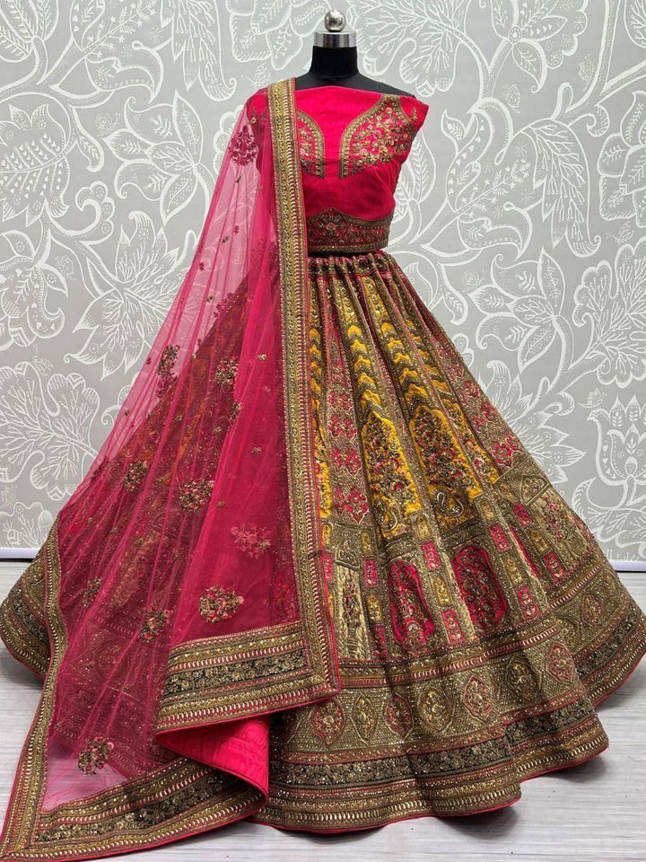 Adorable Yellow And Pink Embroidered Velvet Bridal Wear Lehenga Choli