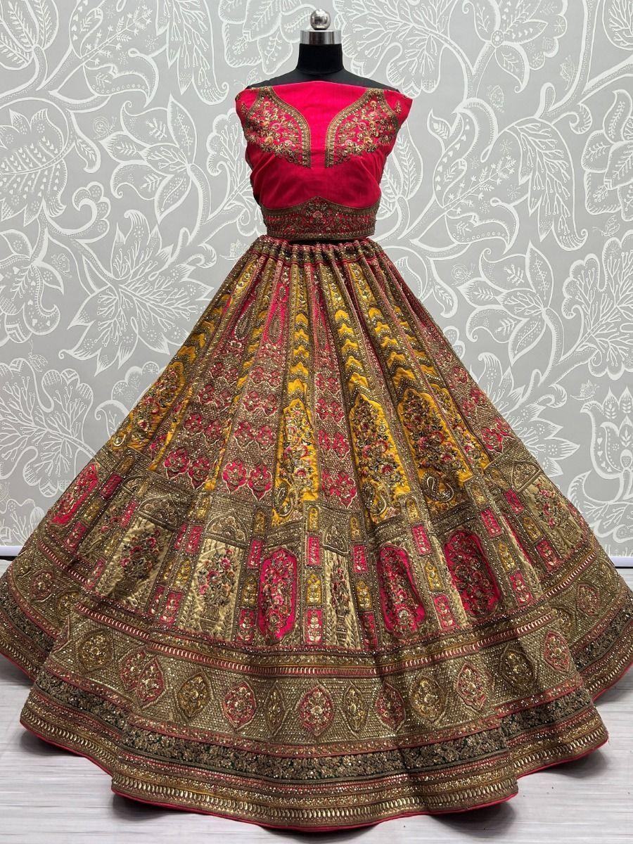 Adorable Yellow And Pink Embroidered Velvet Bridal Wear Lehenga Choli