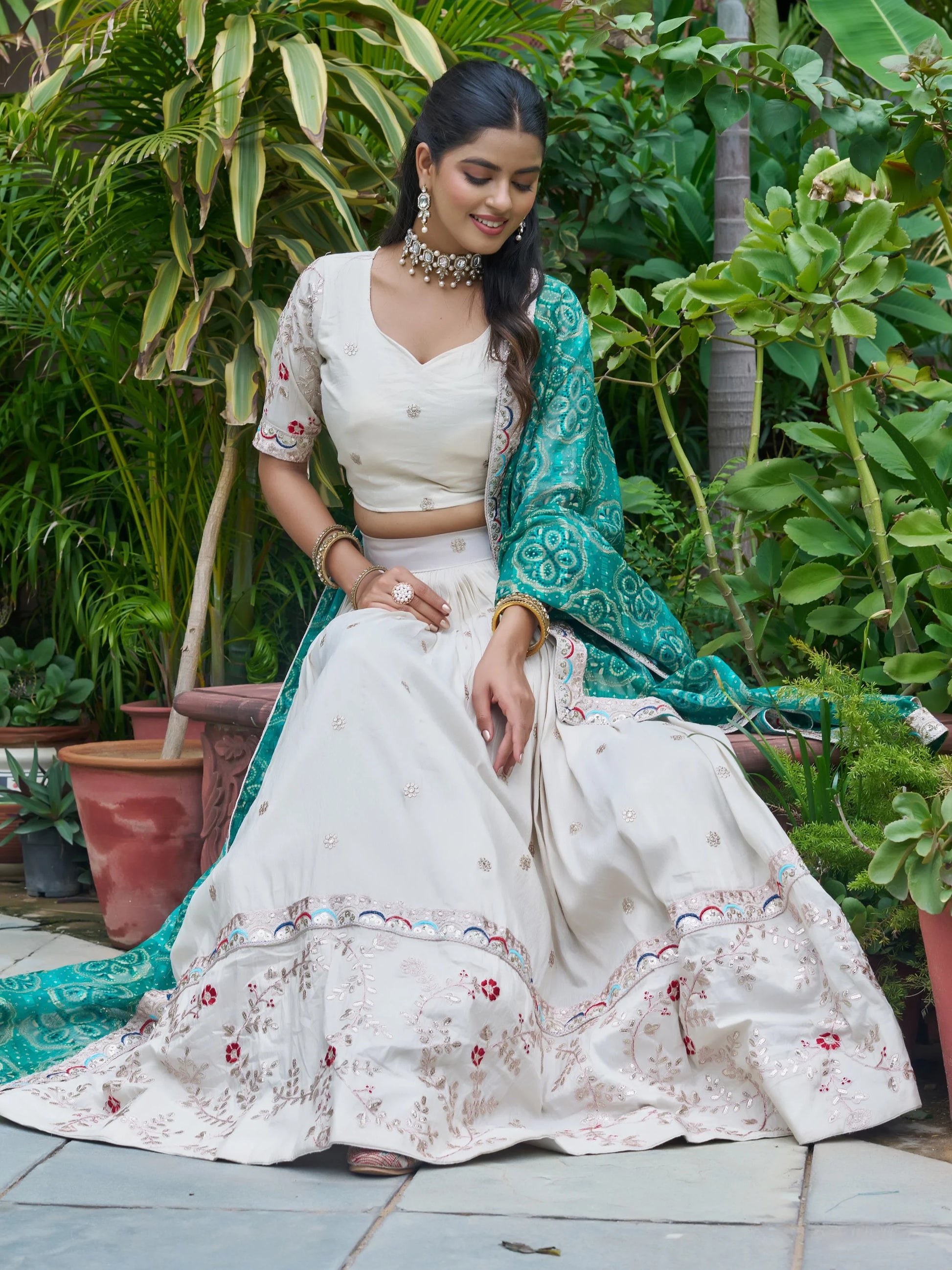 Alluring Off-White Embroidered Silk Lehenga Choli With Teal Dupatta