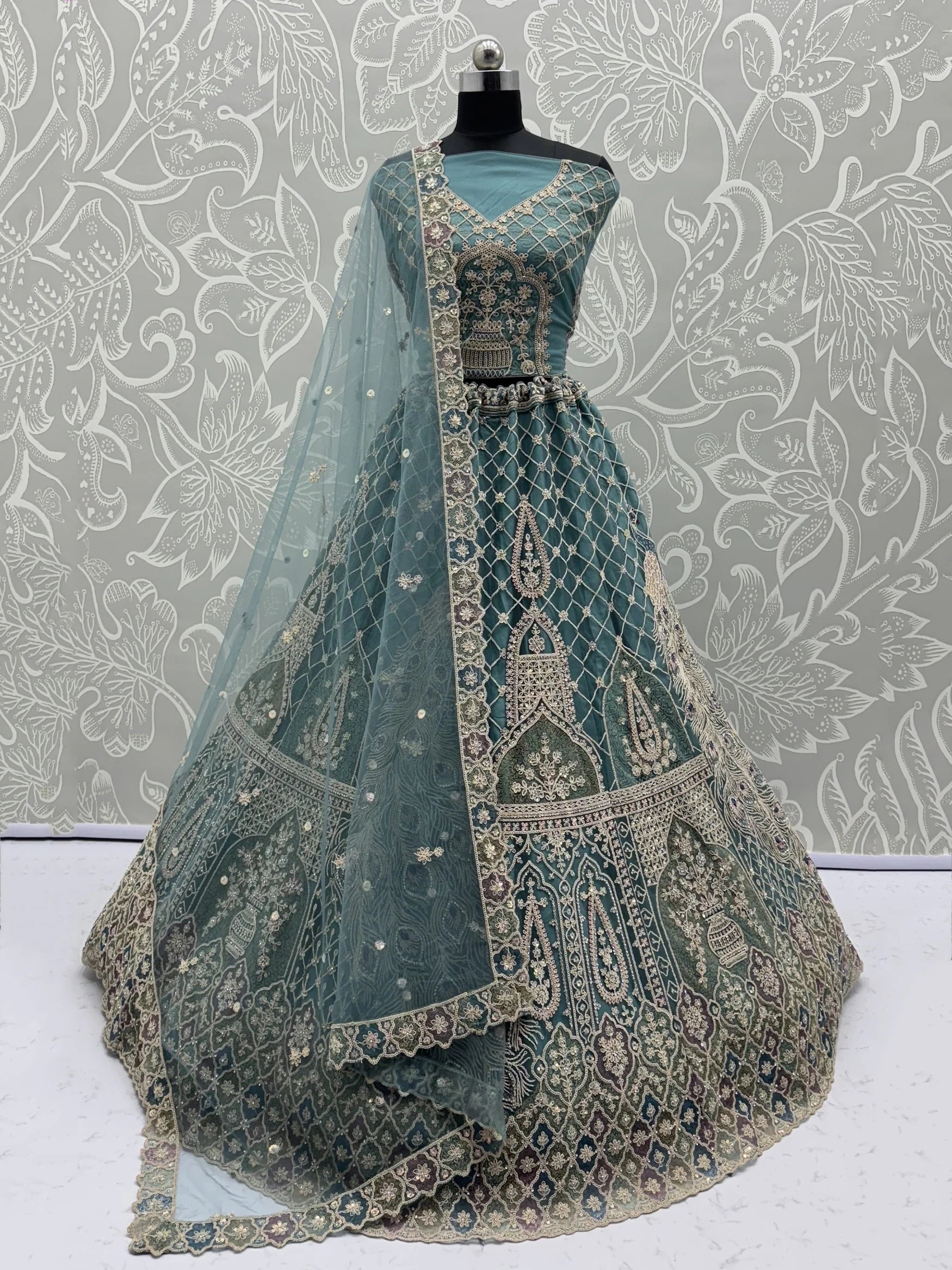 Alluring Teal Blue Zari Work Net Wedding Wear Lehenga Choli With Dupatta