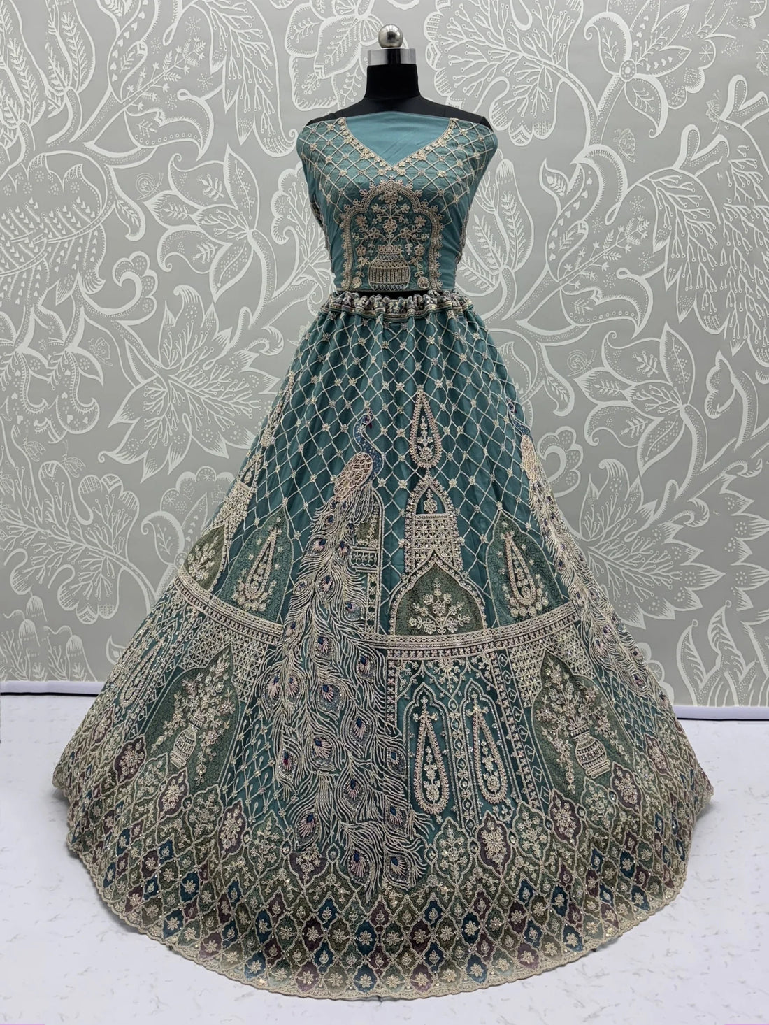 Alluring Teal Blue Zari Work Net Wedding Wear Lehenga Choli With Dupatta