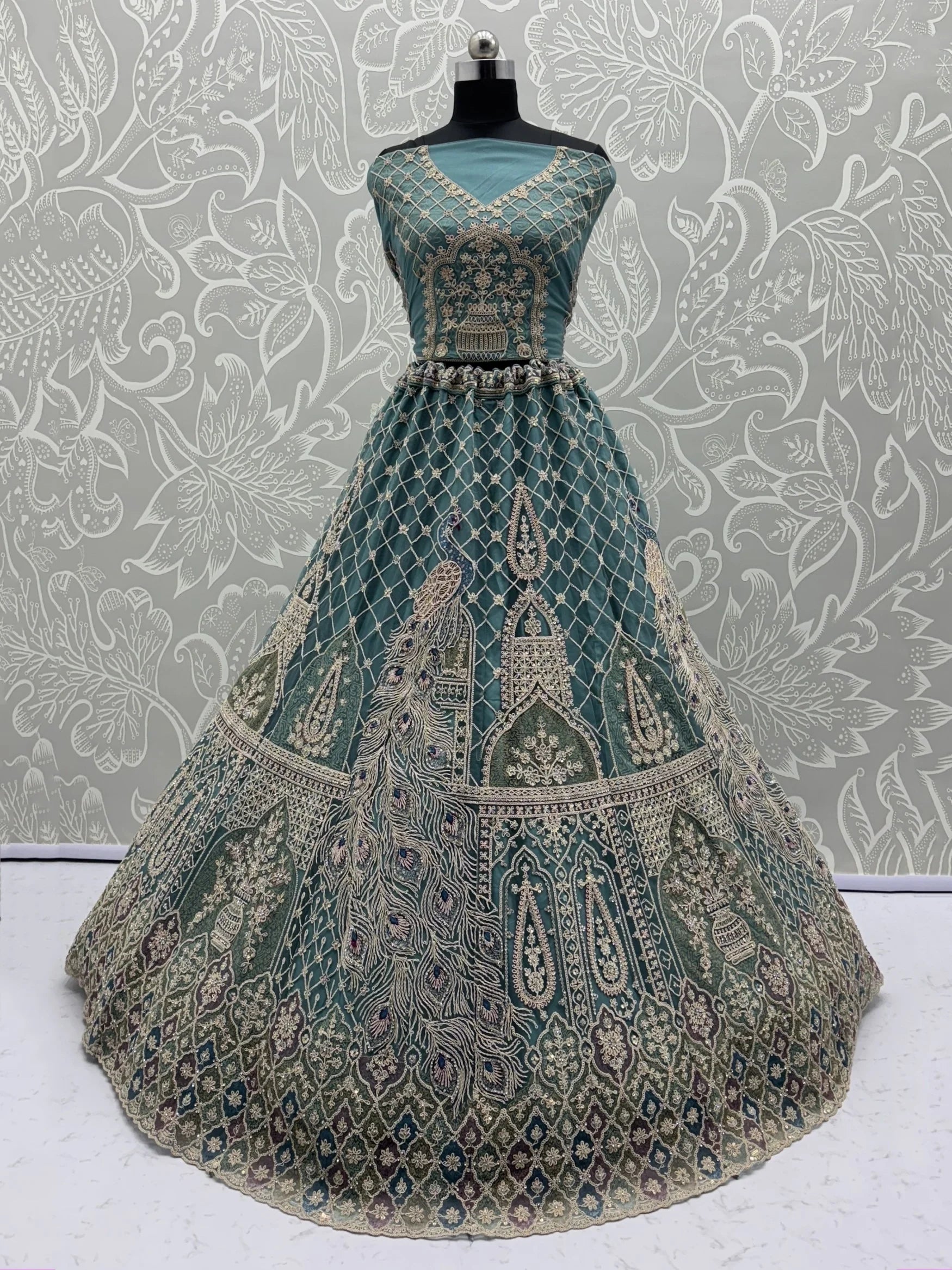 Alluring Teal Blue Zari Work Net Wedding Wear Lehenga Choli With Dupatta