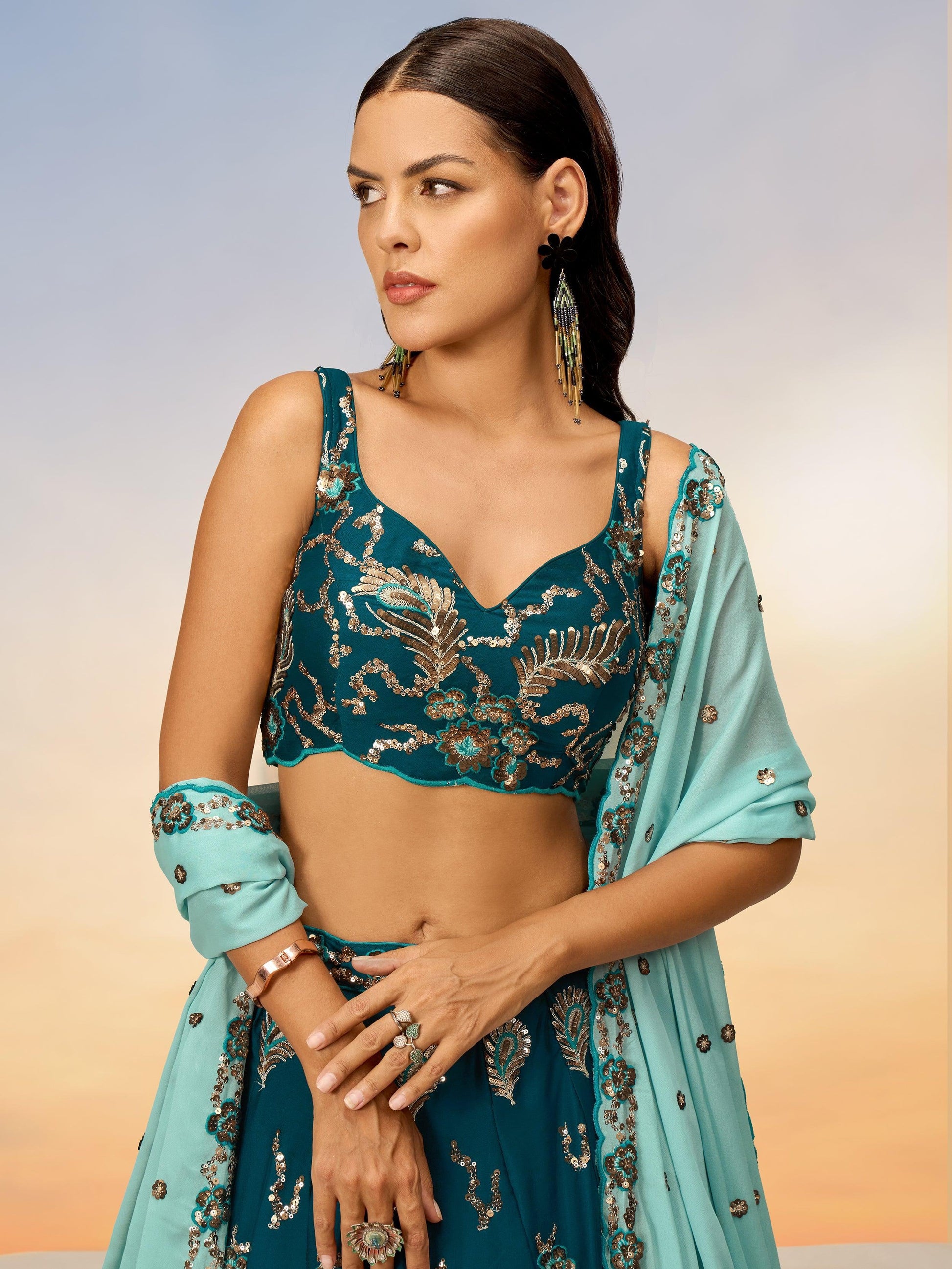 Alluring Teal Green Sequins Georgette Sangeet Wear Lehenga Choli