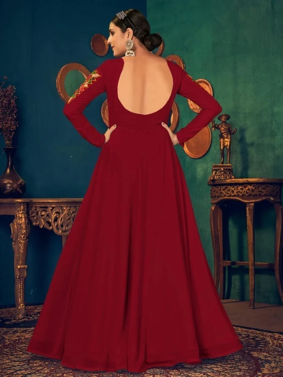 Elegant red long-sleeve gown with open back and embroidery, perfect for formal events and parties