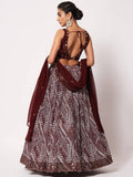 Maroon lehenga with geometric print, open back blouse, and matching dupatta for women's ethnic wear