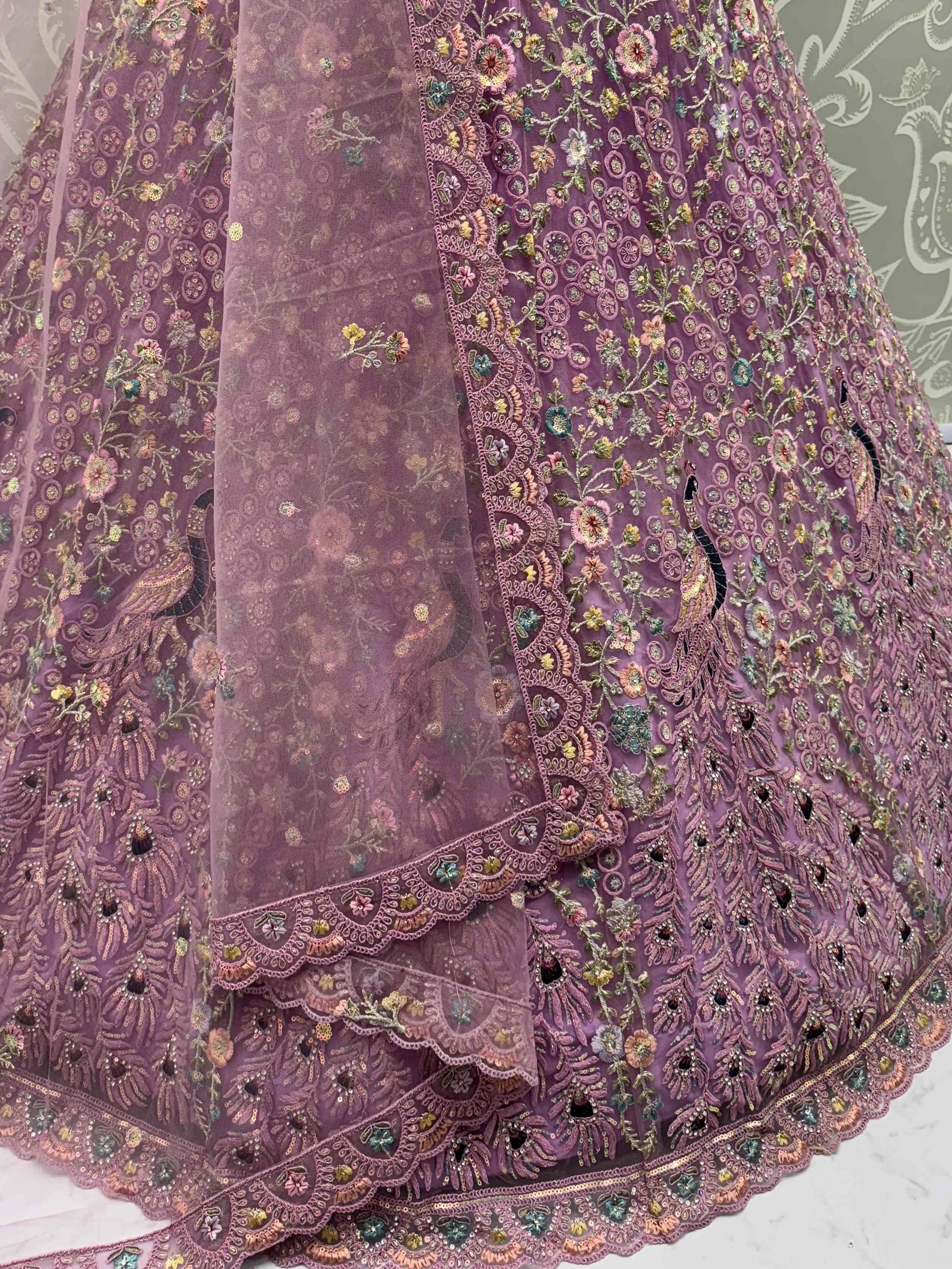 Astonishing Purple Zari Embroidered Net Engagement Wear Lehenga Choli