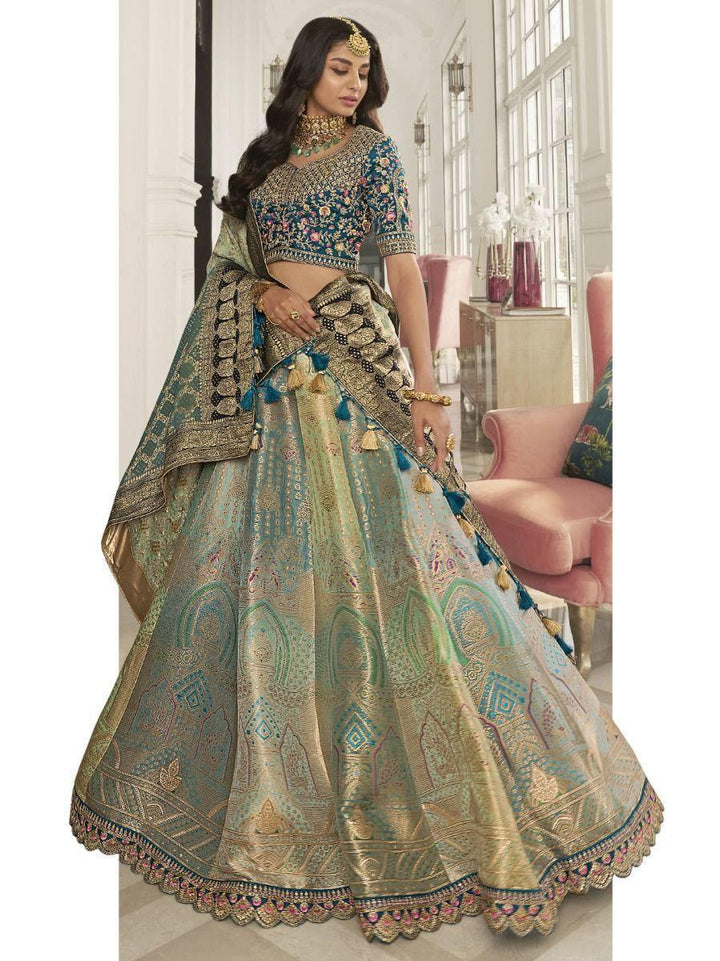 Astonishing Teal Embroidered Silk Bridal Wear Lehenga Choli