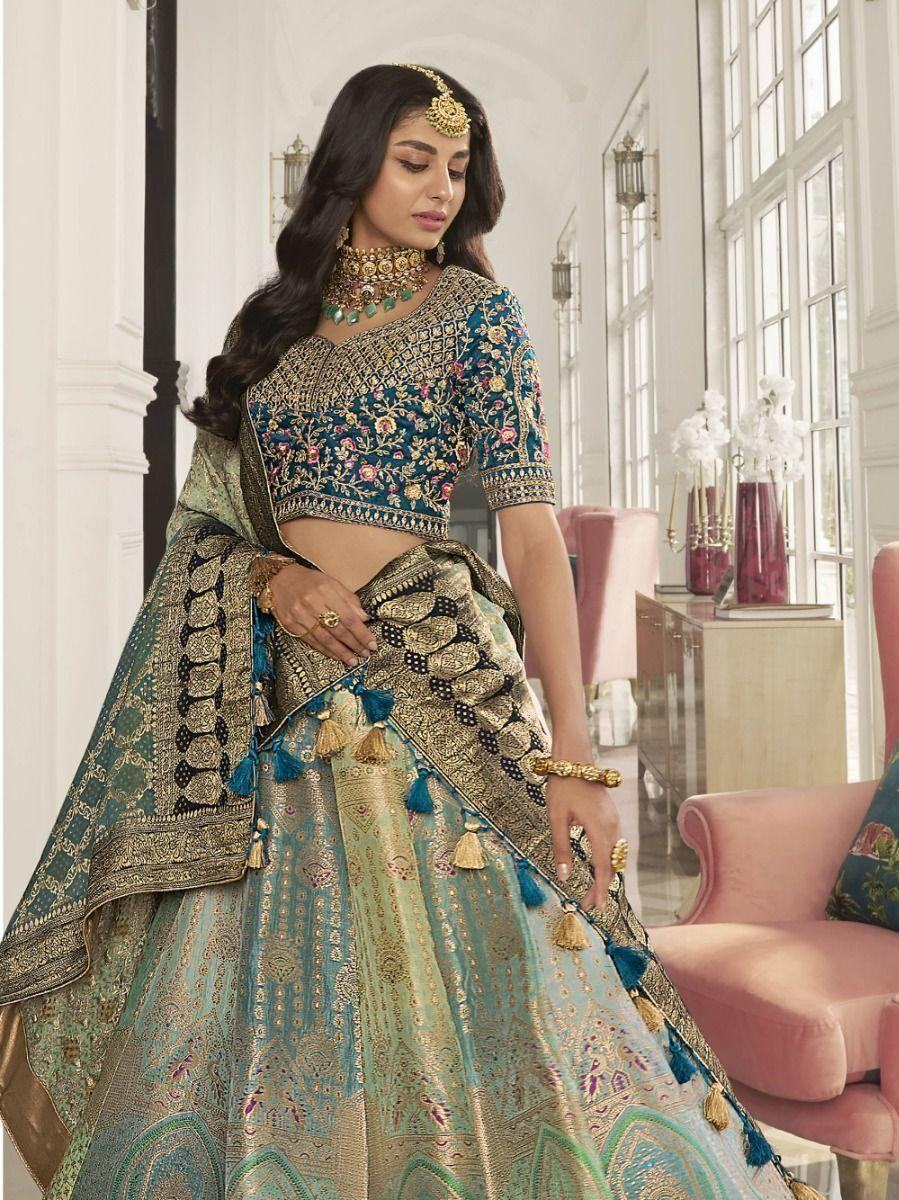 Astonishing Teal Embroidered Silk Bridal Wear Lehenga Choli