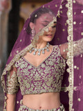 Astounding Purple Zari Embroidery Net Reception Wear Lehenga With Blouse