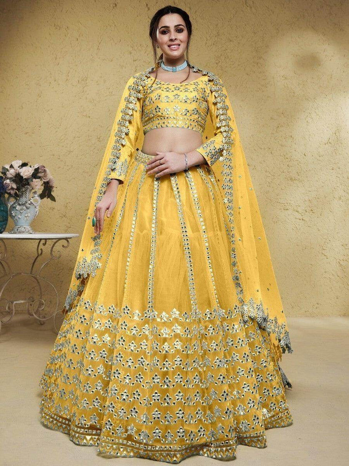 Astounding Yellow Foil Work Net Function Wear Lehenga Choli - Zeel Clothing