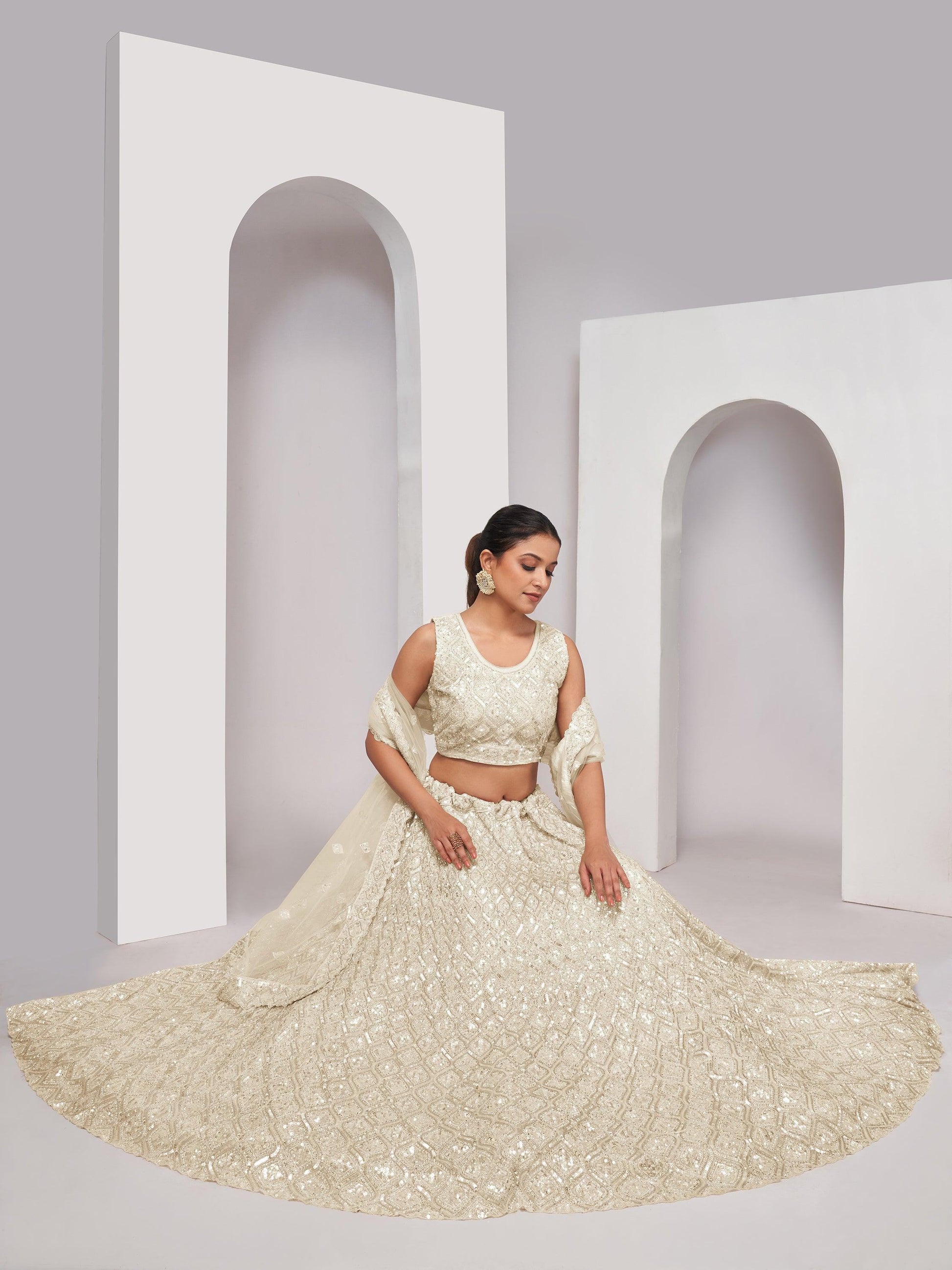 Attractive Ivory Sequins Net Reception Wear Lehenga Choli With Dupatta