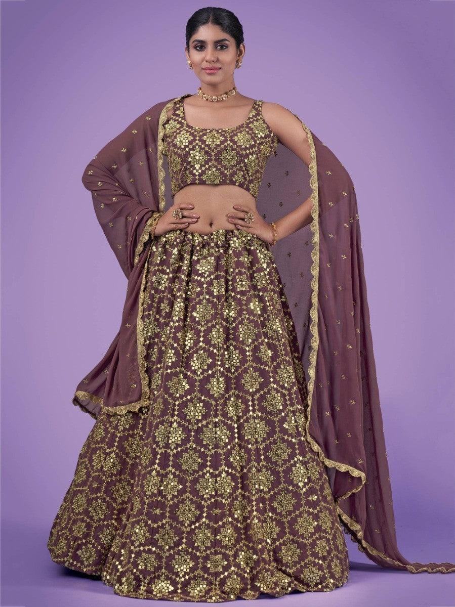 Elegant maroon and gold lehenga with intricate embroidery, perfect for festive occasions and weddings.