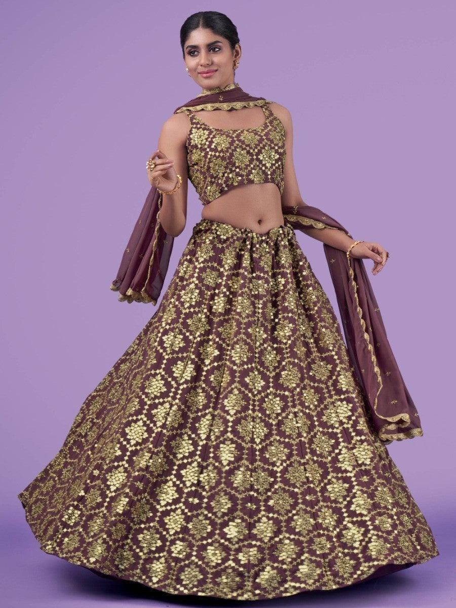 Elegant maroon and gold lehenga choli with floral embroidery, perfect for festive occasions
