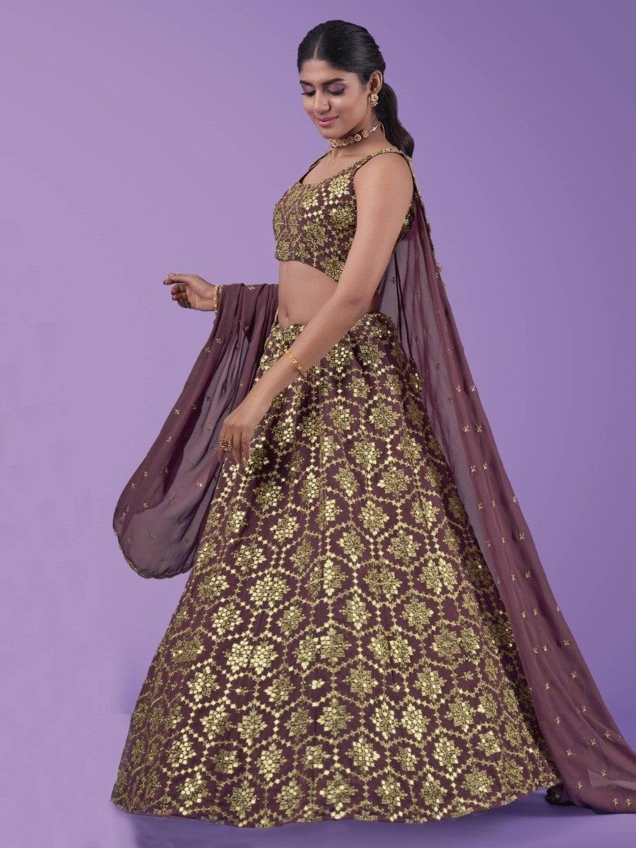Elegant maroon and gold lehenga with floral embroidery, perfect for festive occasions and weddings.