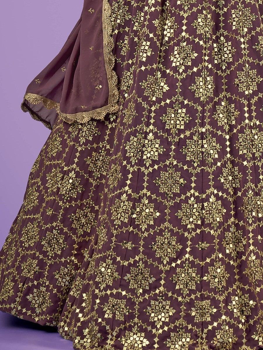 Elegant maroon lehenga with gold floral embroidery and sequin detailing, perfect for festive occasions.