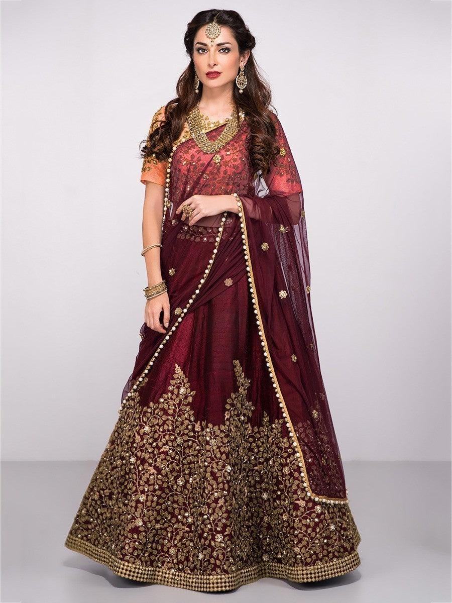 Burgundy lehenga with gold embroidery, perfect for weddings and festive occasions