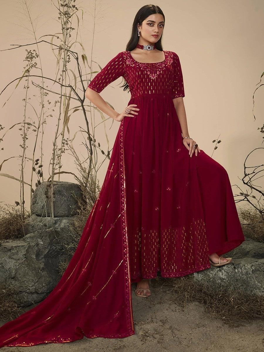 Elegant maroon embroidered anarkali gown with gold detailing, perfect for festive occasions