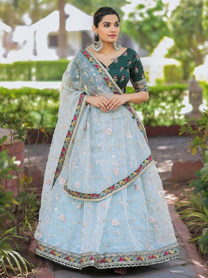 Attractive Sky Blue Thread Embroidery Organza Lehenga With Green Choli