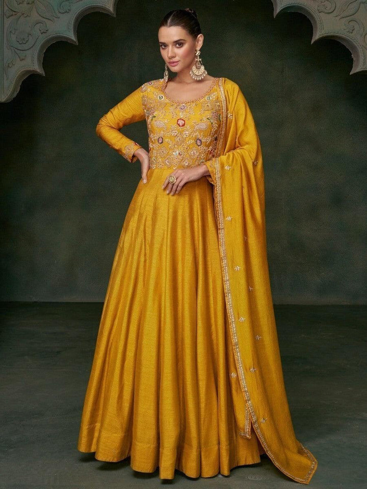 Attractive Yellow Embroidered Silk Haldi Wear Gown With Dupatta