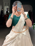 Beautiful White Border Work Silk Onam Special Half Saree Lehenga With Green Blouse
