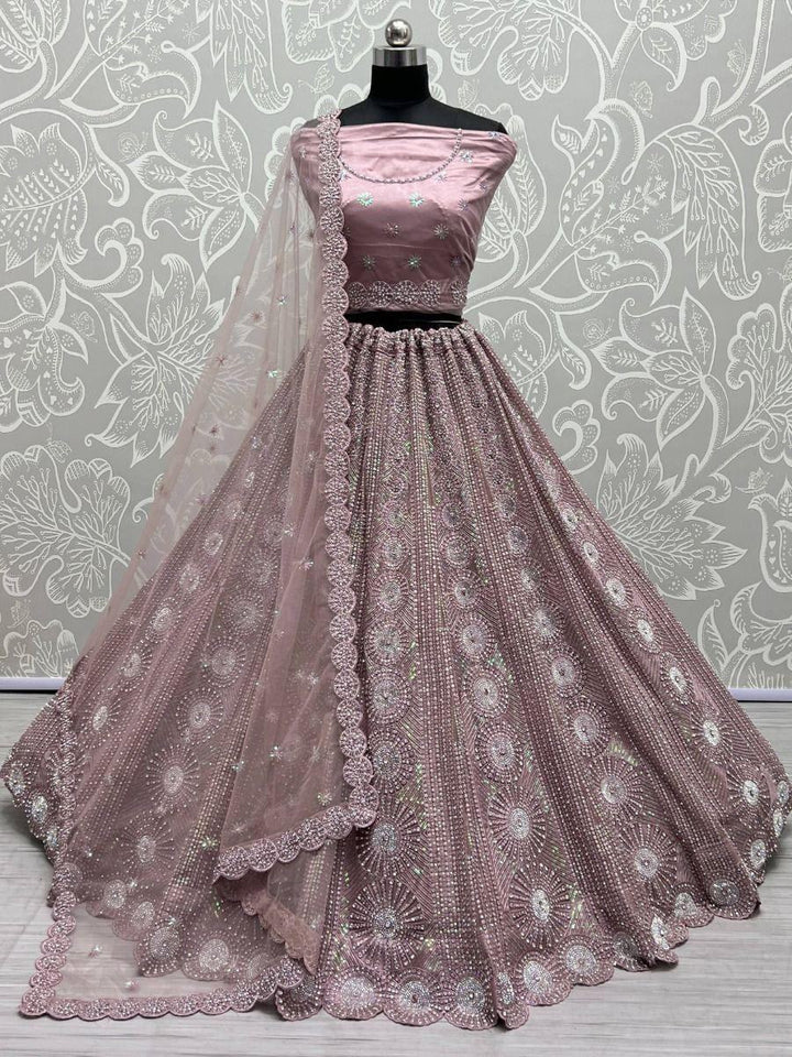 Captivating Dusty Pink Sequins Net Reception Wear Lehenga Choli